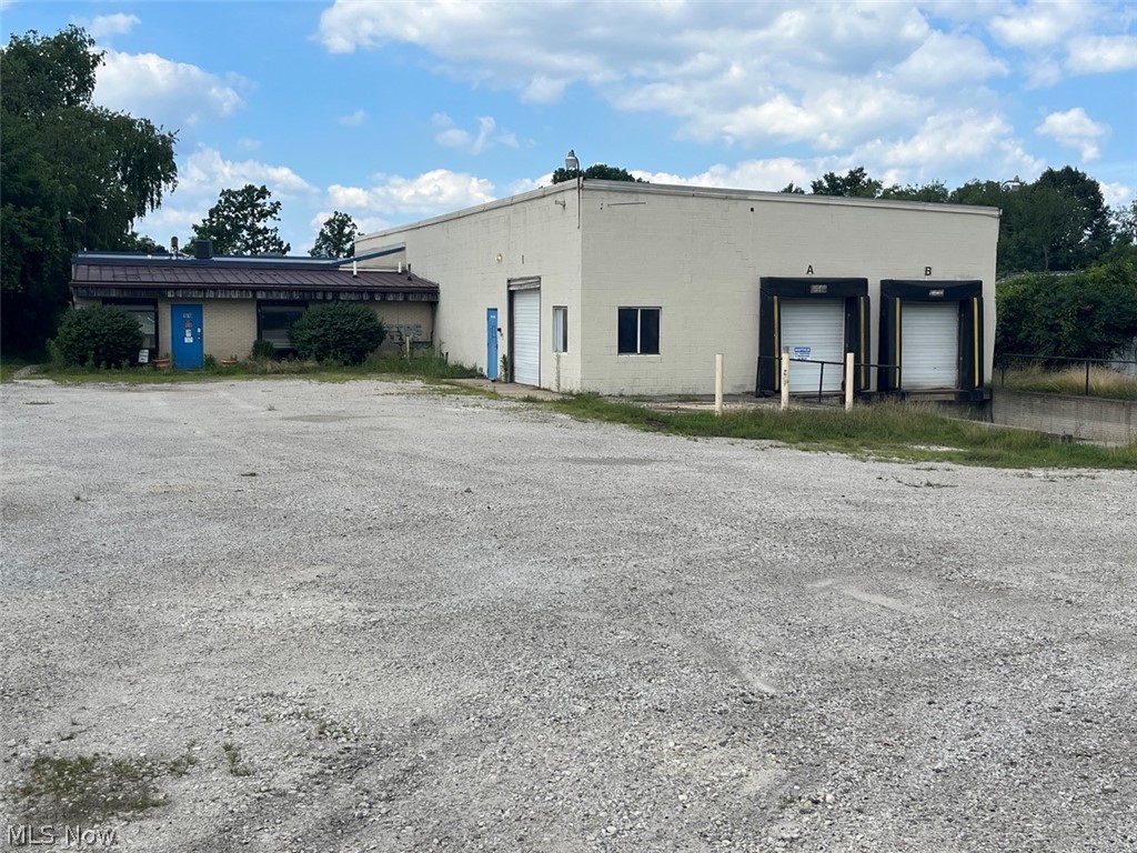 Industrial Zoning - 31,600 Square Foot Industrial/Manufacturing Facility - 2 Acres of Land, 5 Loading Docks 1200-amp/480 Volt of Power - Public Utilities - Close To Highways - Portage County, OH, Kent Township. Live Auction with Online Bidding Available. All sells on location. ONLINE BIDDING BEGINS WEDNESDAY, JULY 31, 2024 – 12:00 PM and AUCTION LIVE ON-SITE BIDDING WILL BEGIN FRIDAY, AUGUST 2, 2024, 12:30 PM. Real estate offers a 31,600-square-foot industrial facility that was built in approximately 1967 with additions added in 1984 and 1997. Property features include a reception area, multiple front offices with gas-forced heat and central air, 5 loading docks, multiple clear span shop areas with 1200/480 power, three bathrooms, Fire-Lite MS-5UD fire alarm system, fire doors between each 10,000 square foot section of space and public utilities. The building is a combination of block and steel, and the roof is approximately 12 years old (white vinyl with additional insulation).  Taxes per half year $8,409. This building is ideal for an owner user or can easily be used as a multi-tenant facility. Easy access to I-76 and the Ohio Turnpike.