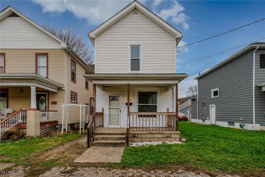 MOTIVATED TO SELL! SELLER MAY OFFER ALLOWANCE FOR CENTRAL AIR OR NEW ROOF TO BE INSTALLED WITH AN APPROPRIATE OFFER!  STOP RENTING AND START INVESTING!  This home could be yours for a monthly mortgage of approx. $611 w/ some zero down loan programs!  (Call your favorite agent). Welcome home to this inviting 2-bedroom residence featuring a spacious eat-in kitchen perfect for casual dining and gatherings. The living area showcases a gorgeous decorative fireplace that adds warmth and character to the space. Step outside to enjoy the covered patio, ideal for relaxing, entertaining, or enjoying the outdoors in any season. This cozy home offers comfort, charm, and great spaces to make your own. Conveniently located right in the heart of downtown Toronto where ample amenities are close by.