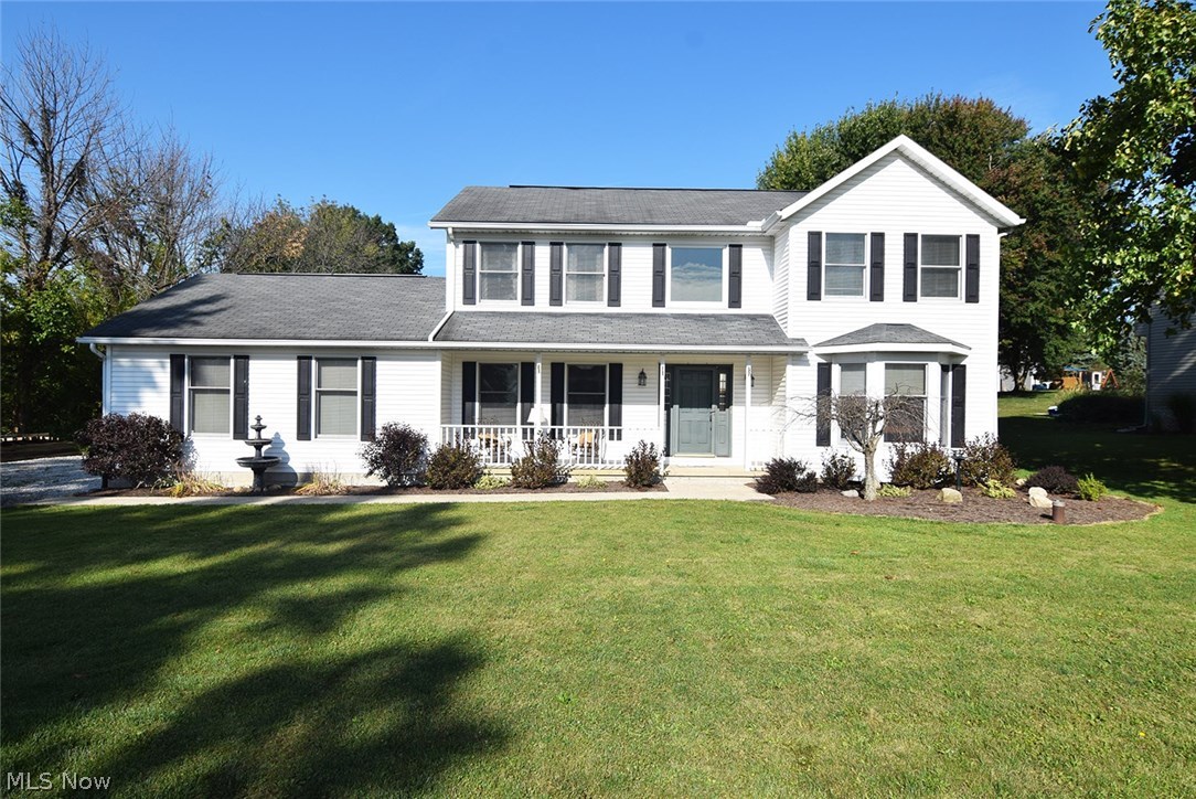 A country setting in a small neighborhood, .9642 acre, on a dead end street is a great location for 11201 Laura Lee Drive in Hartville, Ohio!  Start at the inviting front porch which gives entry to the 2 story foyer. The center hall design provides a bayed formal living and a formal dining room on each side of the foyer. Spacious kitchen boasts cherry cabinetry, Corian counter tops, stainless steel appliances, and ceramic tile floors. The bayed dinette is open the kitchen and the family room. A sliding glass door from the family room opens to the deck, hot tub, and private back yard. The second floor offers a master suite, with a walk-in closet, and a full bath offering a garden tub, and a separate shower. Two more bedrooms, both with walk-in closets, and a second full bath, complete the second floor living space. The newly refinished basement offers a recreation room, an office area, and a fourth bedroom, or play room. Newer hot water tank, and furnace.
