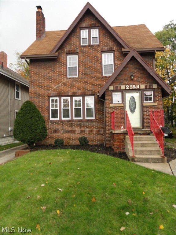 Brick Colonial in desirable location within close proximity to the Fitness Center and the new Front St Promenade offering shops, restaurants, concerts and festivals. This charming home features a spacious formal living and dining room with natural wood trim and a  built in cabinet. Potential for 5 bedrooms with 3 bedrooms on the second floor, a spacious third floor with a closet, and a lower level rec room or 5th bedroom with a fire escape window and a full bath. This home has been well maintained. It has the preferable  hot water radiant heat with a new boiler in 2007. It also has central air with two units to accommodate the whole house including third floor. 2 car detached garage. Priced to sell!