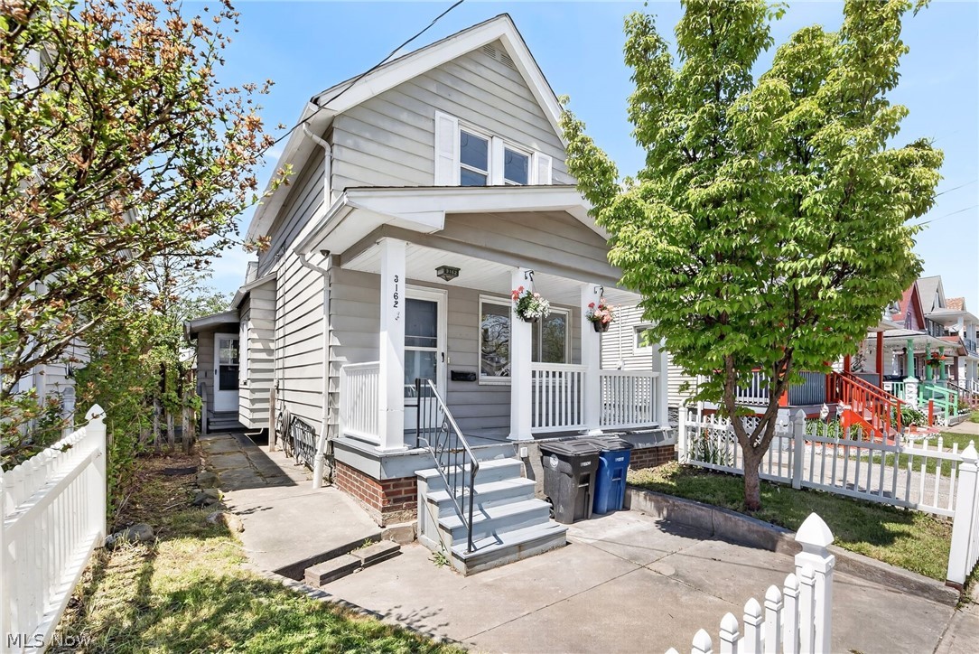 Welcome to 3162 West 104th Street in Cleveland, a thoughtfully updated colonial filled with charm, natural light, and inviting living spaces throughout. The bright and welcoming interior immediately makes you feel at home as the living room greets you upon entry, flowing seamlessly into the dining area and updated kitchen to create an ideal layout for both everyday living and entertaining. Updated luxury vinyl plank flooring runs throughout much of the home, adding warmth and continuity to the space. The kitchen has been refreshed with tasteful updates and offers a functional layout with plenty of room to cook and gather. The main floor also features a spacious bedroom and a full bathroom, providing convenient first floor living flexibility. Upstairs, you will find two additional bedrooms tucked away for added privacy, each offering comfortable layouts and great natural light. Recent improvements include new flooring, kitchen updates, bathroom updates, updated plumbing, and fresh paint throughout, giving the home a move in ready feel. An unfinished basement provides excellent storage space and offers potential for future finishing to create additional living or recreational space. Additional highlights include central heat, classic colonial character, and a convenient Cleveland location close to shopping, dining, parks, and highway access.
