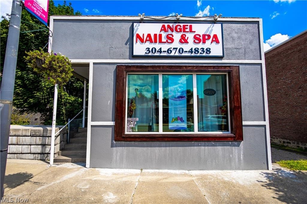 Prime commercial opportunity on Main Street in the heart of downtown Follansbee! This versatile commercial building offers approximately 1,140 sq. ft. of adaptable space, making it ideal for retail, office, medical, salon, boutique, or many other business ventures. The functional layout includes an open business area, private rooms, a full bathroom with walk-in shower, and a dedicated laundry area. A major bonus is the full lower level beneath the building, featuring an oversized garage with abundant storage or workspace. The property also includes an additional parcel that provides extra off-street parking or future development potential, along with rear access for added convenience. With excellent visibility, public utilities, forced air gas heat, central air, and endless possibilities, this is a fantastic opportunity for an owner-occupant or investor looking to establish or expand a business in a high-traffic downtown location.