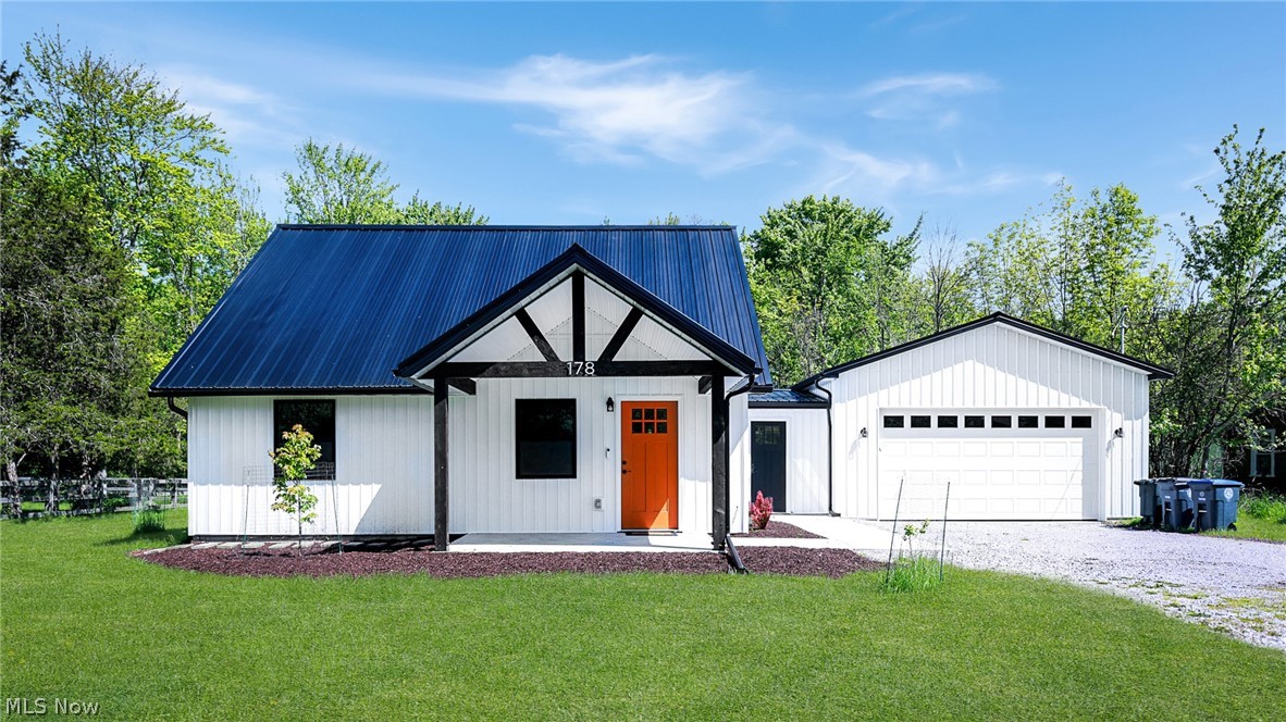 Welcome to this beautifully renovated Cape Cod nestled on nearly an acre just moments from Oberlin College. Backing directly to the scenic North Coast Inland Trail and Oberlin Arboretum, this move-in ready home offers the perfect blend of modern updates, peaceful surroundings, and convenience to town and campus life.

Inside, the refreshed interior features a family room that flows seamlessly into the updated kitchen, complete with granite countertops, painted cabinetry with new hardware, tile backsplash, updated lighting, and newer stainless appliances (2024). The main level offers convenient first-floor living with a renovated primary bedroom, additional bedroom, and a beautifully updated full bath featuring new plumbing, vanity, fixtures, and walk-in shower/tub updates.

Upstairs, you'll find two bedrooms along with additional storage space. Extensive updates throughout include luxury vinyl flooring, fresh interior paint, replaced doors, updated bannister, new ceiling fans, and an ADT security system for added peace of mind.

The exterior has been thoughtfully transformed with new siding, metal roof, windows, doors, and covered front and rear patios (2025). The newly constructed pole barn-style 2-car garage with opener and enclosed heated breezeway adds exceptional functionality and versatility. Additional improvements include a renovated shed, gravel driveway enhancements, shade trees, updated HVAC components including new A/C (2026), and reconditioned furnace with filtered intake vent system.

Enjoy the rare combination of privacy, nature access, and turnkey living in one of Oberlin's most desirable locations. All appliances and fixtures will remain with the home.