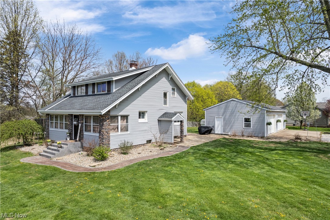 You are going to fall in love with this one! This modern farmhouse takes the relaxed farmhouse style and adds modern touches such as, a bright, open kitchen with custom wood cabinets, granite countertops and windows overlooking the patio and yard. Enjoy an open floorplan with the kitchen open to the dining room and spacious living room.  This well-maintained home showcases original woodwork throughout, high ceilings, and still encompasses the original pocket doors in the dining room. The living room opens to the enclosed front porch which is just waiting for you to relax and sip your morning coffee. The first floor bathroom, recently renovated, offers a first floor laundry hookup! Upstairs, all three bedrooms are generously sized, and all offering plenty of closet space!  The well designed master offers a skylight, walk-in closet and ensuite.  The finished basement features a family room with built in bar area, and a bonus room previously used as an exercise room, currently as storage.