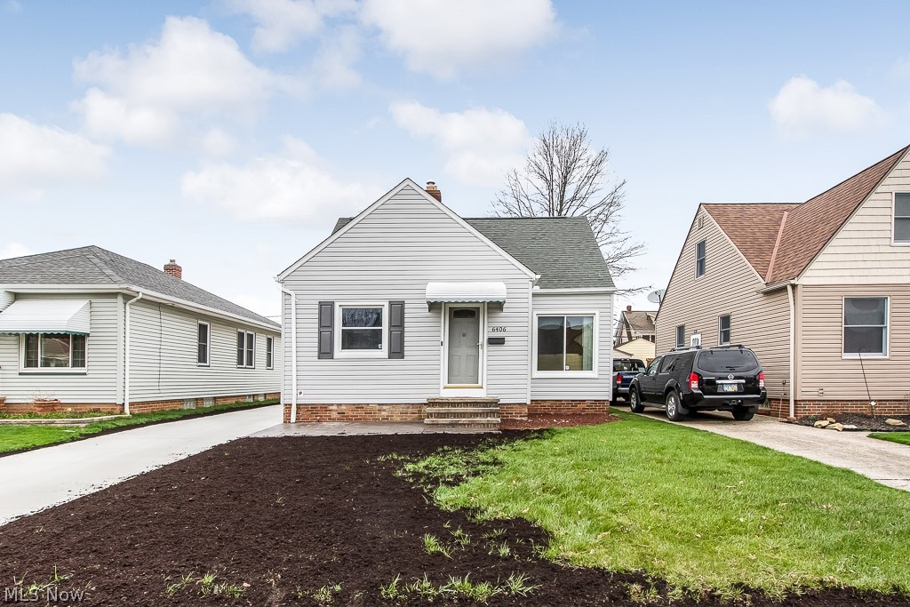 Welcome to your move-in ready bungalow home equipped with a substantial amount of updates.  The first of many  you'll notice is when you first step foot onto the property.  Here entails a new concrete driveway extending all the way to the back of the house providing ample space for parking.  Other exterior updates include 2 stamped and colored concrete patios both on the front and back of the home, new siding from 2017, &  windows from 2013!  Entering the home, it's easy to see the savings from all the work already done for you. The many updates are also accompanied with smart features controlling lights, security system, cameras, & thermostat all from your phone.   This includes modern paint colored walls all throughout, hardwood bedroom floors, and vinyl in the bathroom.  Other beautifully maintained details can be found in the kitchen where you have an incredible backsplash, eat-in kitchen, and plenty of counter and cabinet space.  Going through the main floor you will see both bedr