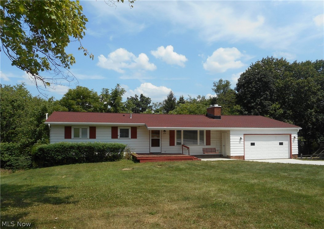 Raised Ranch features 4 spacious bedrooms & 3 full baths.  Sliders from one bedroom lead to a nice deck overlooking the large private backyard, making it perfect for an office or nice retreat.  A woodburning fireplace and vaulted beamed ceiling accent the large living room/dining room combination.  Hardwood floors in 3 of the bedrooms, walk-in shower in master bath, walk-out finished basement with full bath.  Updates include new roof, skylight & gutters (2017) and new concrete driveway (2016).  The sellers are offering a home warranty for peace of mind.