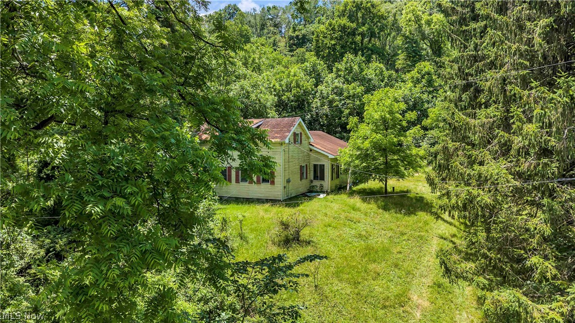 Discover the opportunity to own nearly 5 acres of private, secluded land with endless potential. Tucked away with a peaceful country feel, this unique property offers a rare chance to create your own vision while still being conveniently located near local amenities. The property features an existing prior homesite area and may offer potential access to existing utility infrastructure from previous improvements (buyer to verify). Whether you're considering a new custom build, prefab home, modular home, RV setup, recreational retreat, investment opportunity, or future development potential, this property presents a variety of possibilities. An added potential benefit for future construction: qualifying buyers may be eligible for the City of Salem’s Community Reinvestment Area (CRA) program, which may provide up to a 15-Year Tax Abatement on eligible new construction improvements (buyer to verify all eligibility and program requirements directly with applicable agencies). Property is being sold strictly AS-IS, with all faults. Seller makes no warranties or representations regarding zoning, permits, acreage, utilities, tax abatement eligibility, buildability, septic, sewer, water source, existing infrastructure, condition, or intended use. Buyer is responsible for completing all due diligence with the City of Salem, zoning department, county auditor, building department, health department, and any other applicable authorities. Existing structure on property is in very poor and dilapidated condition and may be unsafe to enter. Seller makes no representation that the structure is habitable, repairable, or safe.