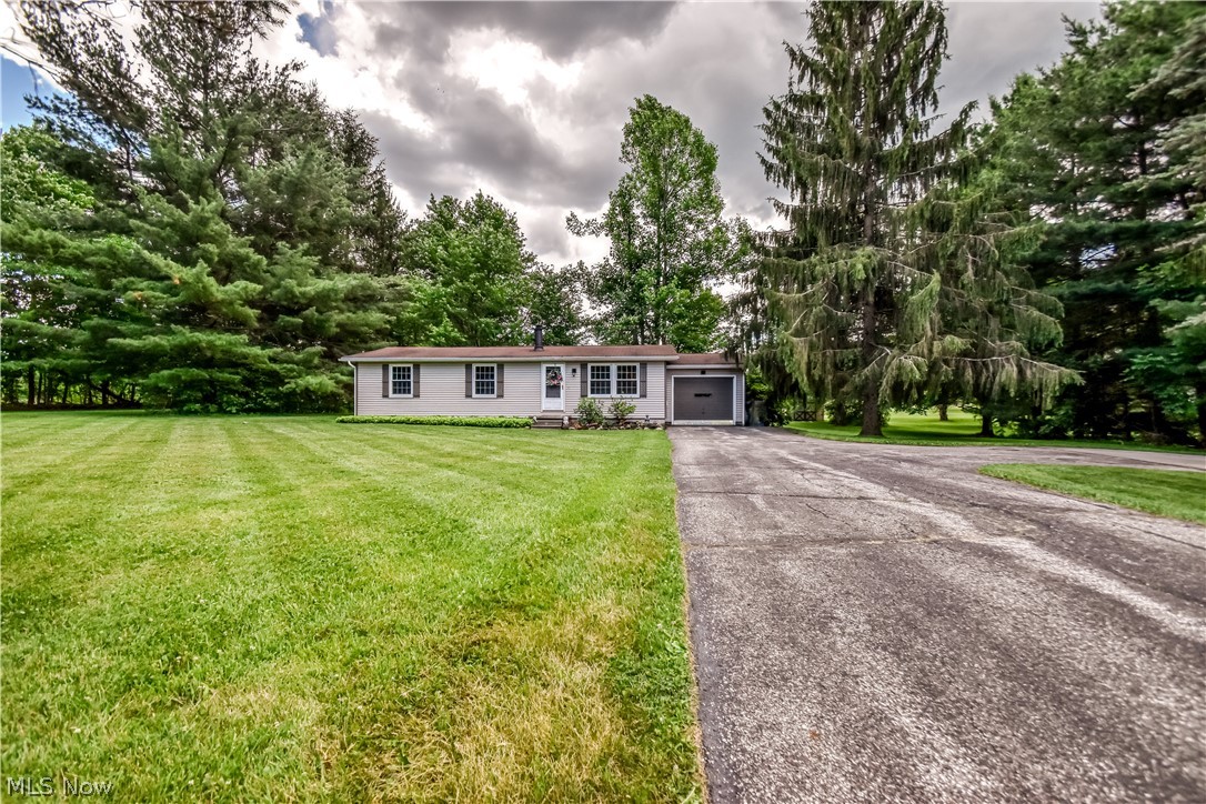 Rare opportunity!! Here is your chance to own an affordable, move in ready home in the highly sought-after Kenston school district on over two stunning acres. Inside this home you will be blown away by the incredible renovated kitchen featuring an abundance of quartz countertop space along with a large island designed specifically to allow comfortable seating around it. The kitchen greatness doesn't stop there, a custom-built panty with sliding barn doors has also been added. The home flows well with a high ease of living being all on one floor with the attached garage. The property itself is a highlight of its own. The wrap around driveway is a nice feature when multiple vehicles are present. The two plus acres are well cared for, there's a 12x22ft lofted shed, a good portion of privacy with trees offering refreshing shade making the warm summer days more pleasant. Chances like this, at this price point, in this area, are few and far in between, so don't wait and schedule your showing now!