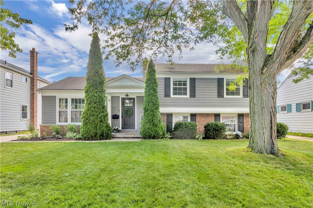 Beautiful and well-maintained split-level home boasts 4 spacious bedrooms and 2 full baths! Updated & bright kitchen with recessed lighting, an abundance of cabinets, granite countertops, an island w/barstools, ample pantry space, and newer appliances. Living room with portrait window and wood floors opens into the dining area with a slider leading to the backyard.  Three bedrooms upstairs and a separate teen suite with built-in bookcase/shelves on lower level.  Updated second floor bath with granite vanity and new shower/tub surround (2026). The family room is the perfect spot for relaxing and features a built-in bookcase and separate storage area.  Attached 2.5 car garage with newer garage door and opener leads into lower level mudroom w/access to bath. Full unfinished basement has tons of storage and laundry area w/sink. You will love the backyard oasis with its cozy, covered porch and fire pit! Furnace (2014), AC (2019) and HWT (2025). Waterproofing and drainage/foundation improvements in 2025 with 15 year transferable warranty to new owner.  Truly a gem of a home you won't want to pass up!