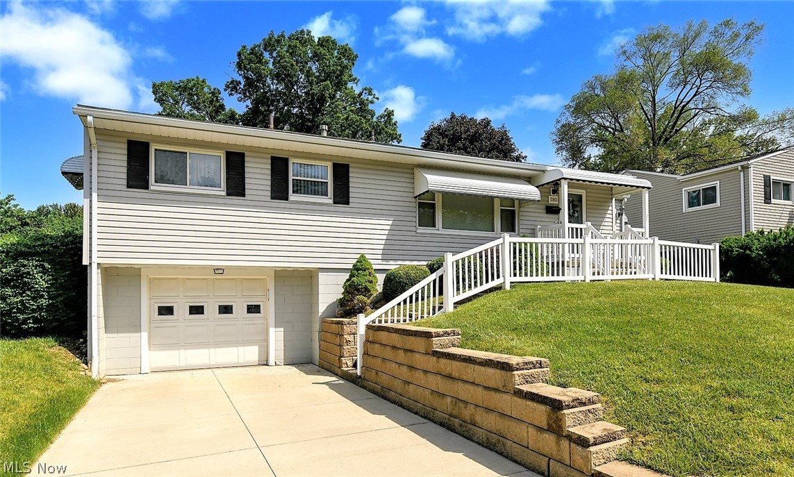 *Beautiful Raised Ranch In Ellet W/1800+ Sq. Ft Of Finished Living Space Including 3 Bedrooms, 1 Bath, Attached Garage & FINISHED Basement W/2nd Kitchen For Entertaining! *SOLID Property Inside And Out! *Major Updates Include: New VINYL SIDING, WINDOWS & ROOF  *New CONCRETE DRIVEWAY, RETAINING WALL & VINYL RAILING *Updated SLIDERS In The Sunroom Addition *2020 Genie Garage Door Opener *Walk In To A Large Living Rm W/Picture Window *Eat In Kitchen W/Updated Hunter Ceiling Fan & Led Light Provides Tons Of Cabinets & Is FULLY Applianced With Refrigerator, Dishwasher, Stove & Microwave *Sunroom W/BEAMED VAULTED 10' Ceiling Flanked By Sliders To The Front AND Back Yard!! *Bdrm #1 Has Ceiling Fan W/Convenient Built In Belt/Purse/Scarf Holder *The 2nd Bdrm Has Double Clothing Racks & 3rd Bdrm W/Ceiling Fan *1st Floor Bathroom Showcases TILE Floor, CUSTOM Wall To Wall Vanity & Countertop, Black Accent TILE Backsplash & Tub Surround! *ENTERTAIN In The FULLY FINISHED LOWER LEVEL!! Consisting Of