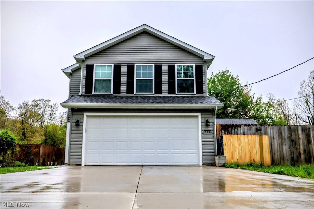 Welcome Home: 3 yr old  "move-in ready"  thoughtfully upgraded, spacious 4 bedroom, 2.5 bath home blends modern comfort with custom touches. - Tucked at the end of a quiet street backing to Metro Parks  PLUS, you're just minutes from Lake Erie-close enough for sunsets, far enough to skip the crowds.  As you enter you will sense the relaxing and bright, open concept . The kitchen and dining area features durable, luxury vinyl plank flooring, granite countertops, soft close cabinetry designed to keep everything organized. The same cohesive flooring, cabinetry and countertops extend through all bathrooms, while the remaining living spaces and bedrooms offer the comfort of carpeting. The great room is centered around a custom- built fireplace and shelving creating a warm and stylish focal point perfect for relaxing or entertaining. The primary suite offers a private retreat with an en-suite bath, separate toilet area and a custom walk-in closet system.3 additional spacious bedroom and an upstairs laundry finish off the upstairs.  Additional highlights include a spacious 2 car garage, a mudroom and extended concrete driveway, fully fenced in yard, and a 12x24 stamped patio ideal for outdoor gatherings. The detached barn has been converted into a functional rage room,perfect for blowing off steam, hosting a unique hangout space, or easily transforming into whatever fits your needs. Built on a private lot so NO HOAand comes wired with 2 security systems.  Don't wait..All these features don't come with new construction.