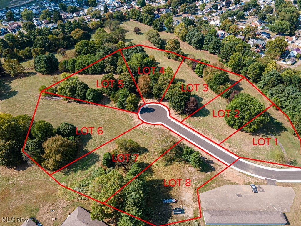 LOT 6 Country Club Drive--Prime Development Opportunity-Scenic Residential Building Lot on Former Golf Course Available for New Owners. Discover a rare offering of a spacious, flat residential building lot of 0.942 acres, nestled within city limits yet tucked away in a serene, secluded setting. Located on a beautifully reimagined former golf course, this building site offers the perfect blend of privacy and convenience. Highlights include city utilities available at the street ready for your build, sweeping views of natural landscapes and rolling greens, easy access to nearby amenities, schools, and shopping. This residential building site is positioned just behind newly constructed condominiums, offering a quiet, upscale neighborhood feel all in a secluded setting with mature trees and open skies on a private drive cul-de-sac. Whether you're a developer seeking a boutique community site or a homeowner dreaming of a custom estate with room to breathe, this location delivers unmatched potential. Zoned for residential use and surrounded by nature, yet minutes from everything—this is where opportunity meets tranquility. Contact your licensed agent and schedule your tour of the building site today and envision the possibilities.