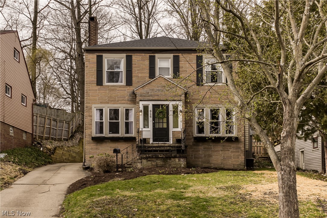 Don't miss this beautiful and light filled classic colonial on a charming red brick road in Highland Square! Exceptional property with many updates.  On the first floor you will find a large living room with fireplace that opens to both the spacious dining room as well as a den with built in shelves.  Toward the back of the home is a bright and sunny kitchen that leads out to a sun porch and the charming back patio and yard.  A half bath finishes off the first floor.  Upstairs you will find 4 very nicely sized bedrooms and a large full bathroom, plus a walk up attic, perfect for additional storage. Large basement with very high ceilings lends itself to much potential. Modern neutral paint throughout!  Recent updates include roof in 2017, waterproofing and new water line to the street in 2018, updated electric, a rebuilt retaining wall in 2016, and many replacement windows throughout.  Home warranty included! This one is a must see, move right in and enjoy!