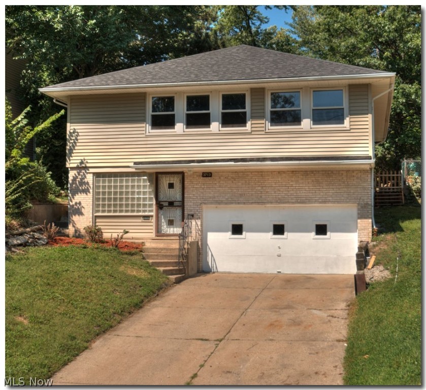 Welcome Home to this Unique Bi-level house in Prime Location with Many Updates and Features! 4 Bedrooms, 2 Full Bath. Beautiful Harwood & Ann Arbor Oak Laminate Flooring. The Main Floor Offers Open Floor Plan with a Large living room, Dining area and Kitchen with stainless steal appliances . 3 Bedrooms and a full Bath. The Entree Level Offers a Large Family/TV Room and a Potential in-law Suite with it's own Bedroom and Full Bath. 2 Car Attached Garage. Enjoy the private backyard that is perfect for entertaining. Close to shopping and easy commute to downtown Cleveland and major hospitals.