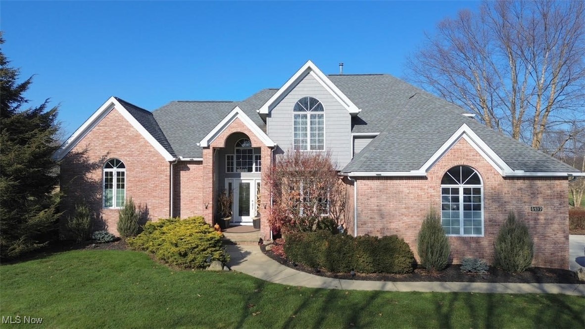 Located in Copley Township within the award winning Copley-Fairlawn School District  Rural living at it's finest, but just minutes to shopping, restaurants, and expressway. Custom-built in 1995, well-maintained and updated throughout the years.  The house boasts 3,110 sf of living space, plus an 12’x14’ 2nd floor bonus room.  The home features (2.5) baths, (4) bedrooms, vaulted ceilings, (2) fireplaces, sunken great room, (3) car garage, formal open dining room, large finished basement, and in-kitchen hearth room.

An open floor plan featuring a large modern kitchen with luxury stainless steel appliances from Viking, Bosch and GE, granite counter tops, a unique island with storage and stainless steel surround, and WI Red Birch hardwood flooring.  The kitchen is open to the bay-window dinette area, and a hearth area with a see-through gas fireplace.  The first floor also offers an open foyer, ½-bath, dining room, sunken great room with vaulted ceilings, laundry/mud room, and master bedroom with en suite.  There are heated floors throughout the bathroom and custom California style closet.

The second floor offers a full bathroom, (3) spacious bedrooms, each with walk-in closets, reading nook, and a bonus room currently configured as a guest room.

The basement is finished with over 1400 sq/ft of living space.  There is a TV sitting area with wall mount electric fireplace, ping pong area, a furnished workout room with sauna, a storage / utility room, a heated walk-in vault, a craft room, and a billiard area with diamond plate wainscoting, complete with a Gandy pool table.  The billiard table, sauna, dry bar, and workout equipment are offered as part of the sale price.  Many other pieces are available upon request.

The home sits on a beautiful, mature, 1.62A lot.  Double wide concrete drive, stamped concrete walk to rear of property, 27'x42' out building/garage/pool house, and a 20'x40' inground, salt water, heated pool.