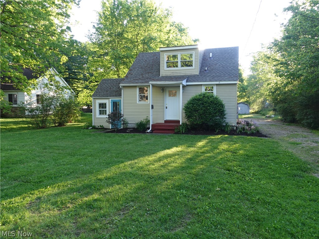 Cute as a button!  This is a great opportunity for an investor or consider buying your own home for less than renting!  Just move in to this super cute property  in Stow!  Good amount of kitchen cabinets and counter space, pantry and brand new stainless steel appliances (2020), nice bath, spacious living room with sliders to back patio to huge, flat backyard.  Even has a first floor laundry room with cabinets for storage.  Upstairs, you will find 1 large bedroom with built ins and another bedroom OR use the second bedroom as a good sized walk in closet!  Nice area/separate room can be a 3 season sun room.  New carpeting - 2020 and new roof - 2019.