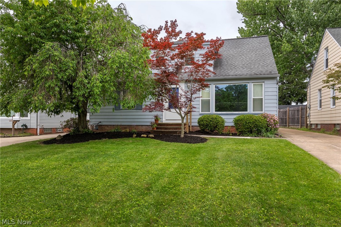 Welcome to 5042 N Barton Rd in Lyndhurst, a spacious and inviting family home that offers more room than meets the eye. Enjoy the lovely trees and front garden. The generous living room features hardwood floors, a full wall of windows for abundant natural light, and a new front storm door, flowing seamlessly into the dining room, sunroom, and newer remodeled kitchen with granite countertops, newly installed glass tile backsplash, new faucet, brand-new appliances, and excellent lighting throughout. The first floor also offers a freshly painted primary bedroom with ceiling fan and double closets, along with a full bathroom and convenient spacious laundry room. Upstairs boasts four additional bedrooms, one is currently staged as an office and another is ideal for a nursery or flex space. There is also a full bathroom on the second floor with a shower. Most of the bedrooms have hardwood floors and some include built-ins. The side door entry also includes a new storm door. The finished lower level includes a large rec room with carpeting, additional space for workouts or play, and extra rubber foam tiles ready for future updates. The workshop and utility area features a newer HVAC system (date unknown), a hot water tank installed in 2026, updated electrical and includes a freezer, cabinets, and tables that remain with the home. Outside, enjoy a patio, good-sized yard perfect for entertaining or gardening, and a one-car detached garage with a new garage door opener, along with a long driveway that accommodates at least four vehicles. Move-in ready and located in the South Euclid-Lyndhurst school district, this home is conveniently close to the Metroparks, shopping, restaurants, and more. Make your appointment now for a tour of this lovely home.