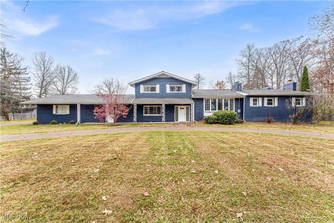 Stunning, fully renovated split-level home on over an acre in Hudson! This exceptional property combines modern design, high-end finishes, and spacious, light-filled living areas throughout! The exterior impresses with fresh slate-blue paint, a welcoming covered front porch with wrought-iron pillars, and a convenient horseshoe turnaround driveway.

Inside, discover 5 bedrooms, 3.5 bathrooms, and 4 fireplaces! The main level features a formal living room with large bay windows and a brick accent wall, plus an open-concept kitchen and morning room filled with natural light. Elegant white cabinetry wraps the space for abundant storage, complemented by granite countertops and a center island with bar seating.

A luxurious rear family room showcases a striking stone fireplace and sliding doors to the deck—perfect for entertaining or relaxing at home! The first-floor master suite includes its own fireplace, a full ensuite bath, and convenient access to first-floor laundry and a powder room.

Upstairs, find three additional bedrooms, including a large ensuite, plus a beautifully updated main bath. The lower level offers another family room with fireplace and walkout access to the patio, along with a fifth bedroom—ideal for guests or a home office.

Outside, enjoy the expansive backyard and a 4-car garage with workshop space! Recent updates include newer HVAC, roof, electrical, paint, and fixtures, making this home move-in ready. This Hudson gem offers style, comfort, and elegance—schedule your showing today because it won’t last long!