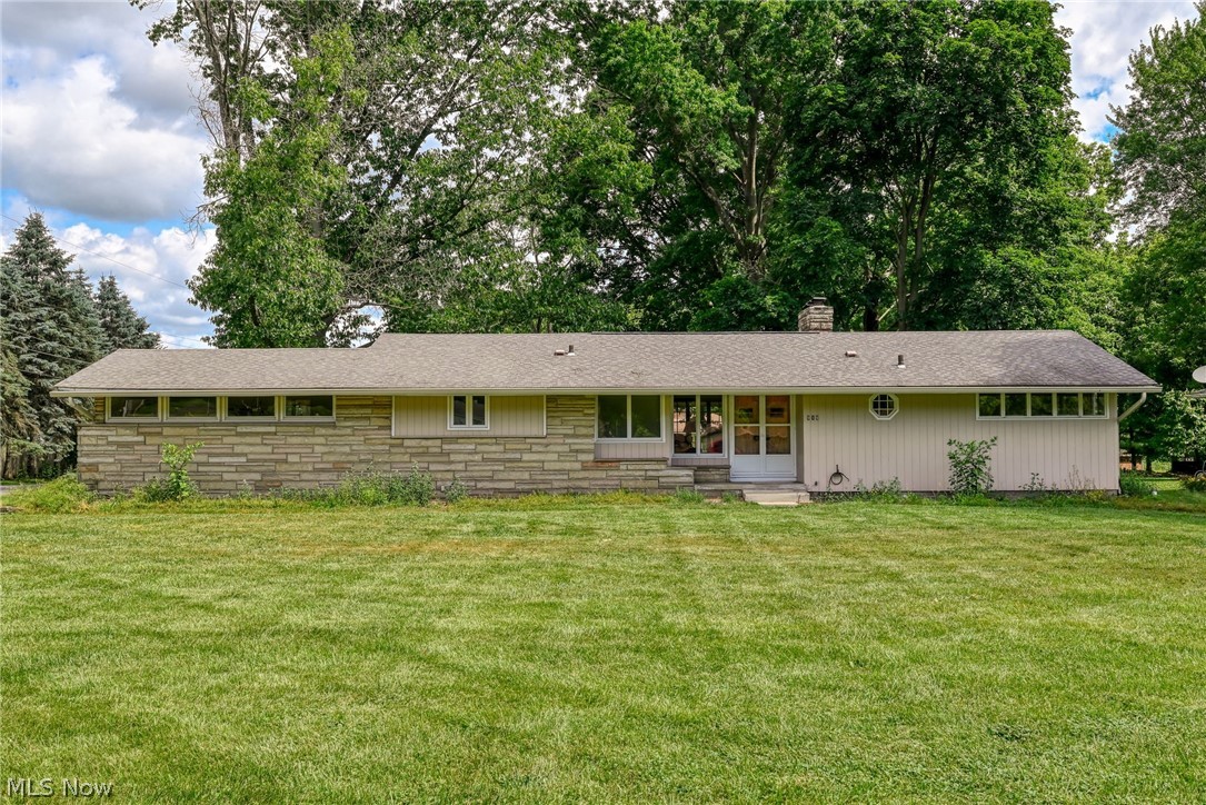 Welcome to this lovely ranch home on more than half an acre of property.   Builder smartly considered the view of the property and so  the living room  faces the spacious back yard.  This home has been well maintained and was recently updated with a beautiful newer white kitchen with tile backsplash, plus updated baths as well as some updated windows.   The living room/dining room combination features built in bookcases, a woodburning FP and hard wood floors.  Lower level has beautiful tile floor in the rec room as well as a second woodburning FP.  Hurry to see this lovely home and enjoy one floor living.