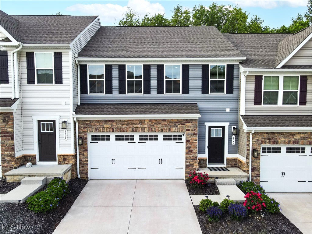 Welcome to 1541 Spruce Hill Dr, a beautifully maintained 3-bedroom, 2.5-bath townhome located in the desirable Towns of Cedar Crest. Built-in 2022, this 1,838 sq ft home offers modern living in a prime location between Hudson and Stow, with easy access to highways and shopping.

The main floor features an open-concept layout filled with natural light, connecting the great room, dining area, and a stunning white kitchen complete with stainless steel appliances. Upstairs, the spacious master suite includes two walk-in closets and a private bathroom with a walk-in shower. Two additional bedrooms, a full bath, and a convenient laundry room complete the second level.

Enjoy the newly added back deck—perfect for relaxing or entertaining—and benefit from a clean, unfinished basement that offers endless potential. A radon mitigation system has already been installed for peace of mind.

Experience low-maintenance living with exterior upkeep included in this vibrant townhome community. Don't miss your chance to own this stylish and move-in-ready home!