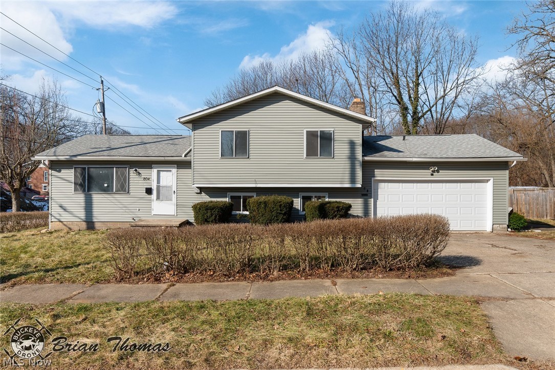 Welcome to this freshly painted split level home including a two car attached garage. Entering through the front door you will notice the larger living/dining areas with easy access to the kitchen featuring new stainless appliances. Moving to the upper level there are three spacious bedrooms and the updated full bathroom. The large lower level family room features a wood burning fireplace and a new sliding door allowing for easy access to the backyard. Don't miss the lower level fully updated half bath. Wait, there's more! Updates include new LVP and carpet throughout, updated bathrooms, some new windows, new kitchen and interior door hardware. Don't miss the opportunity to view this home!