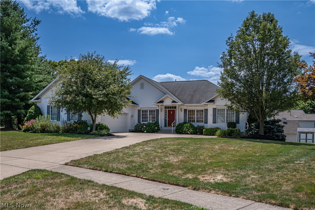 This spacious ranch, nestled on a tranquil cul-de-sac, offers a blend of comfort and convenience in a quality-built home. The entry hallway and dining room warmly welcomes you, while the living room features vaulted ceilings, a gas fireplace, and patio doors that open to the raised deck. The eat-in kitchen, adorned with cherry cabinets, combines style with practicality. The primary bedroom includes an en-suite bath and a walk-in closet for added privacy and space. An open staircase leads to the finished lower level, which offers a versatile recreation room, a full bath, and a 4th bedroom—perfect for guests or a home office. Located near a neighborhood park and just minutes from Seville Village, I-71, and I-76, this home provides both comfort and easy access to major routes.