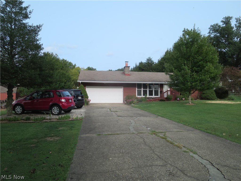 This home has two fireplaces. One is gas and the other is wood burning. Seller is leaving lots of firewood to help you through the winter. 5 bedrooms, 3 full baths. Walk in closet. Beautiful yard with lots of flowers and lovely landscaping. This home has two furnaces. Screened in porch and hot tub. Equipped with a wheel chair ramp that can be easily removed with steps underneath. The orchard includes apple, plum, peach, cherry, crab apple and pear trees. There are several berry bushes which includes Red Rasberry, Black Rasberry, Blue Berries, Goji Berries, Aronia Berries, and Honey Berries.  Concord grapes, Niagra grapes and Arctic kiwi. There is also a raised garden bed. There is a cistern that is used to water the plants and it holds 8050 gallons of water. In the courtyard there is a lovely firepit. The garage has extra storage. There is also two storage buildings and another Rubbermaid storage shed. The home is larger than it looks from the outside.