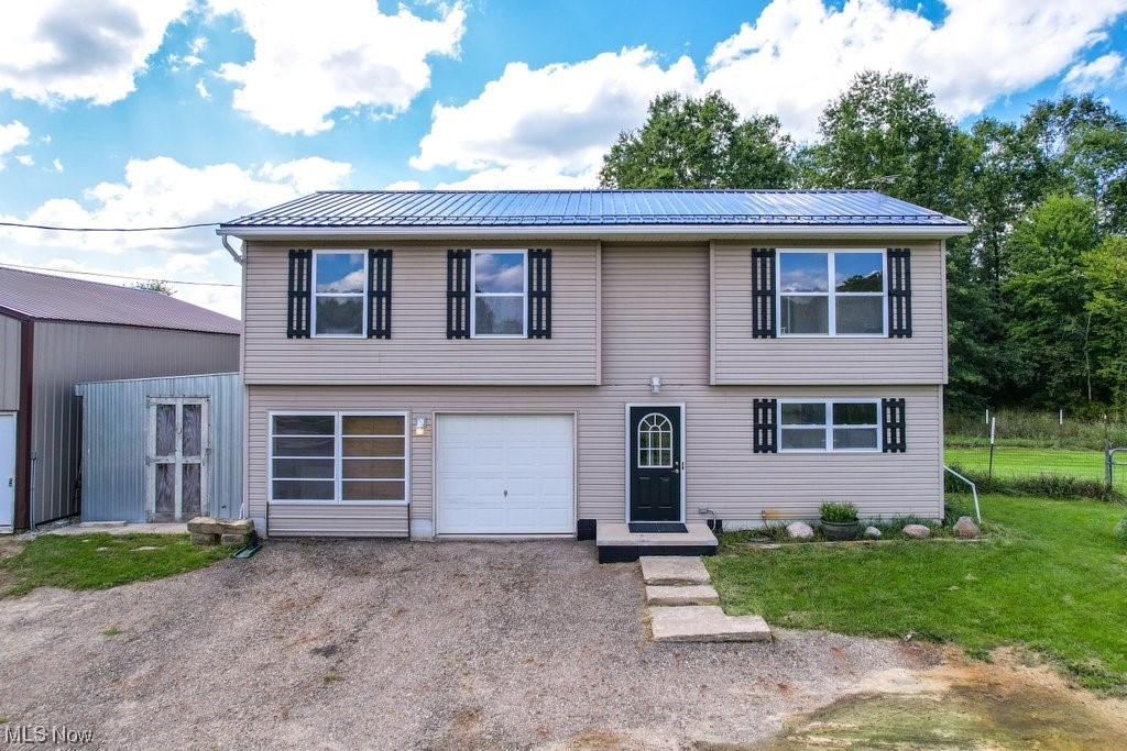 Welcome home to 341 State Route 225 in Atwater! This well-maintained 3 Bed/2 Bath home is located on 10 spacious acres that are absolutely perfect for a hobby farm. The 2nd level features neutral paint & ceramic tile, an open & bright living room, a large eat-in kitchen w/appliances that stay, a newer sliding glass door (2021) leading to the 2-level deck overlooking the wooded lot. 3 bedrooms are located on the 2nd level w/a full bath accessed from both the hall & the Master. Head down to the lower level where you will find an additional living area that could be used as a 4th bedroom or a rec room, a 2nd full bath & utility room. Newer metal roof (2023) & a water softener (2021). The 10-acre property was previously used as an organic farm raising chickens/pigs/turkeys & features a 30x40 metal pole building w/12 ft walls & partial slab, pond w/aerator, metal 11x18 meat processing room that can be converted back to a garage or storage, a dog door off the 2 car garage with fenced area, e