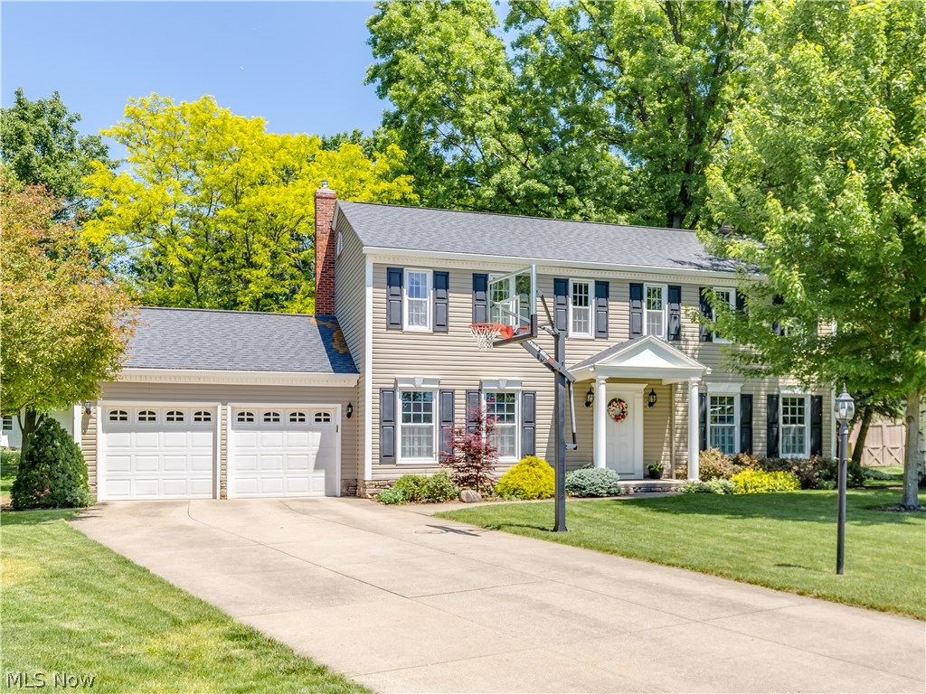 This immaculate Colonial is situated on a quiet cul de sac in the highly sought after Hills and Dales subdivision in the Copley/Fairlawn school district. Current homeowners since 1992 have lovingly maintained and carefully updated it by always adding extra features to improve it's appearance and value. Crisp clean exterior plus a lush green lawn and landscaping with a large flat backyard and brick paver patio with a view that makes you feel like you are at the park! Foyer entry, extra spacious formal living room, formal dining room, eat in kitchen overlooks the family room with wood burning fireplace. Gorgeous hardwood floors throughout. 5 bedrooms allows plenty of space for family, visitors or office! Squeaky clean basement with plenty of  room to finish.  New roof,windows, siding and 6" gutters all within the past 10 years. Ideal location, lovely setting, superb condition. Must see!