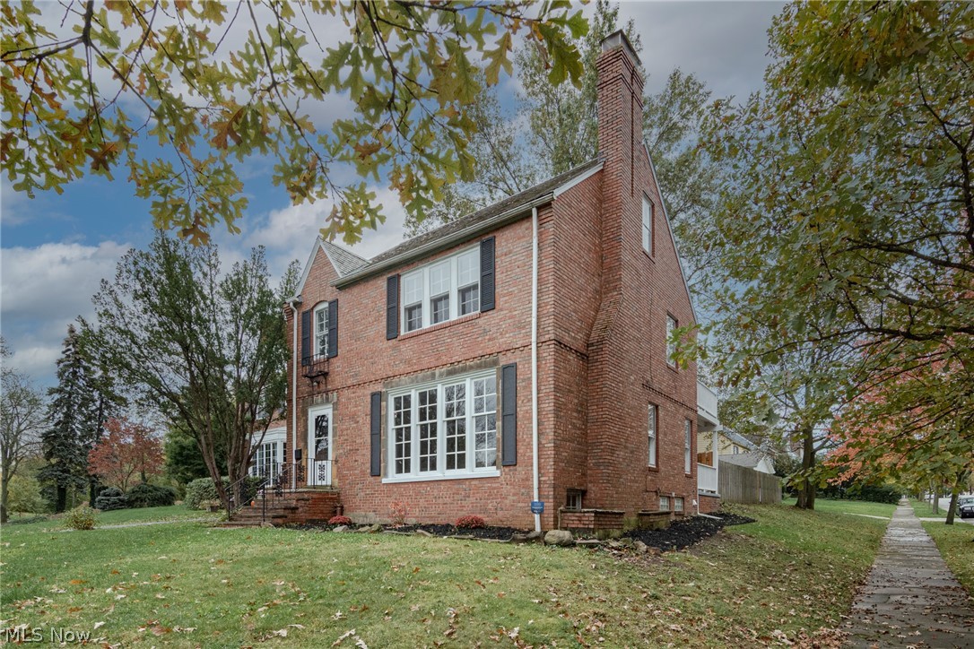 Move right into this charming Shaker Heights colonial! This all-brick home features 4 bedrooms, 2.5 bathrooms, hardwood floors, an updated kitchen, and more!  The front door opens to the left side of the home, with a spacious and sun-filled living room unfolding to your right. Here you will find built-in shelving, a beautiful fireplace, and a several tall windows. Hardwood floors flow into the formal dining room which also opens to the back yard. A cozy dine-in area connects the dining room to the kitchen. Here you will find granite countertops, stainless steel appliances, and plenty of cabinet space. A convenient half bath completes the first floor. There are three bedrooms and a tastefully renovated full bath on the second floor. The third floor includes a fourth bedroom plus another full bathroom! The lower level features wood panelling, another fireplace, and fresh paint. Outside, there is a nice back porch, privacy fencing, and a 2-car garage. Conveniently located just minutes awa