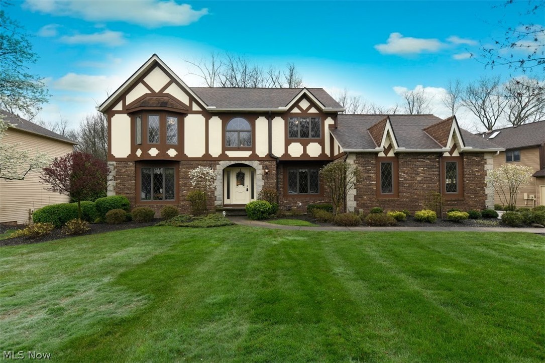 This charming one owner custom built Colonial is located in the desirable subdivision of Country Woods - just minutes away from the Breckville Metropark and Cuyahoga Valley National Park.  4 Bedrooms, 3.5 Baths, 1st floor Den and Utility Room.  Vaulted Family Room with corner woodburning fireplace opens to spacious 28' island Kitchen.  Approximately 4,200 sq.ft. of finished living space includes large walk-out Basement with full Bath, a 2nd Office area, and Rec Room. Plus there is a Basement Wine Storage room with climate control and racking for 500+ bottles!  3-Season Sunroom 15x15, updated landscaping and sprinkling system.  Newer roof, furnace, and hot water tank.  Thermostat controlled gutter ice cables.  Security system, central vacuum, and wall surround sound speakers stay.  One year home warranty.  Almost forgot: 3-car attached garage plus almost a 300'deep lot with small scenic creek and lots of treed privacy.  Highly rated Brecksville/Broadview Heights Schools.  Don't miss the