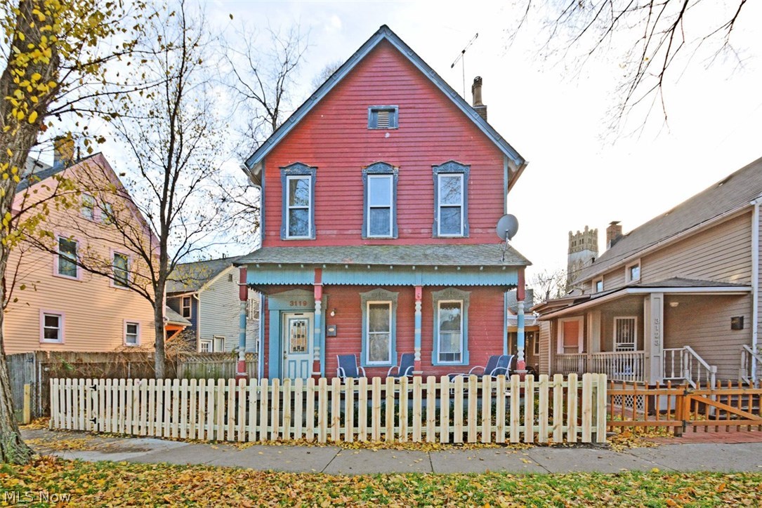 Welcome to 3119 Woodbine Avenue.  This charming updated colonial is located in the acclaimed Historic District of Ohio City.  Located across the street from the Iconic Johnny Mangos World Café & Bar, minutes to downtown Cleveland, Edgewater Park, Hinge Town & The West Side Market, this home is in “The Heart of Ohio City”. Walk up to a private fenced in yard and gated driveway.  A spacious front porch and entry expose nicely preserved century old wood floors and staircase.  Tall ceilings & windows and original oversized wood trim throughout the 1st floor are accented by exposed brick and a quaint old world fireplace.  A New kitchen, half bath, and 1st floor laundry for convenience finish out the first floor. The 2nd Floor Boasts a Master complete with a spacious closet and a Sitting Area that can be used as an office.  You will appreciate a large Bathroom with Jacuzzi Tub and custom ornate tile accented by subtle exposed brick. Two more bedrooms on the second floor for guests & plenty o