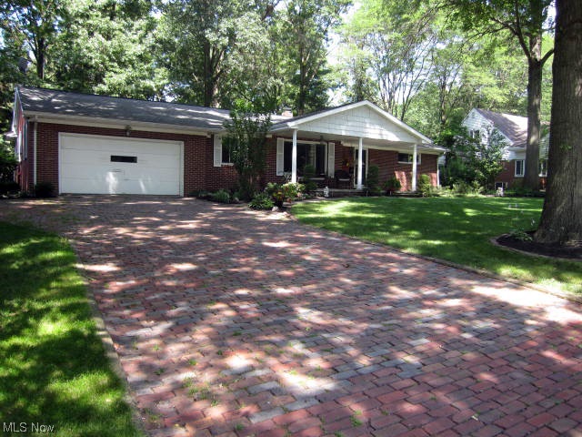 Executive sized Brick Ranch in beautiful neighborhood in Silver Lake Village.  The driveway is brick paved.  Eye catching huge front porch looks out to professionally landscaped & manicured front yard.  The back yard is large and there's a patio off the master bedroom plus a good sized storage shed.  Inside is a massive living room with gorgeous hardwood floors and fireplace with full wall built in cabinets and wired for above mantle TV.  Kitchen has been updated Craft maid Cabinets, double oven and has just been freshly painted in fashion neutral colors.  The entire first floor has recently been painted in decorator colors.  Master bedroom addition features walk-in closet, dressing/sitting room, on-suite bath, vaulted ceiling and double door slider to patio.  Both bathrooms have been totally updated and main bath has double sinks.  Basement has a huge family/recreation room plus a finished office.  There is an auxiliary well for watering lawn and washing cars.  All kitchen appliances