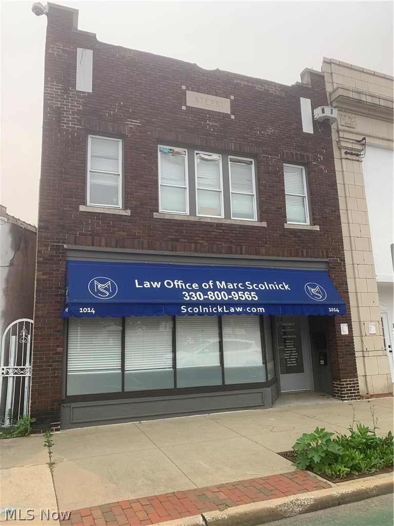 Check out this rare opportunity, to own a commercial/retail building, on the famous, Kenmore Blvd, business corridor.                   This commercial, mixed use building, features an updated, attractive street level retail office space, with high traffic visibility.
This building provides over 2,500 square feet of office space, with a client waiting room and up to 5 office spaces. The lower level is large enough to be a conference, training room or Flex space. There are 2 bathrooms provided, one on each level. The rental potential for the new owner is from $1,000 to $1,200 per month. This space will easily convert into any office set up you desire. There is ample street parking in front of the building, as well as, 6 parking spaces in the rear of the building. There is also a second floor, 2 bedroom, 1 bath residential unit, providing $850 per month rental income. Tenant pays all utilities and lease expires approximately in Feb, 20227.
Contact your favorite Realtor or contact the listing agent for your private showing.