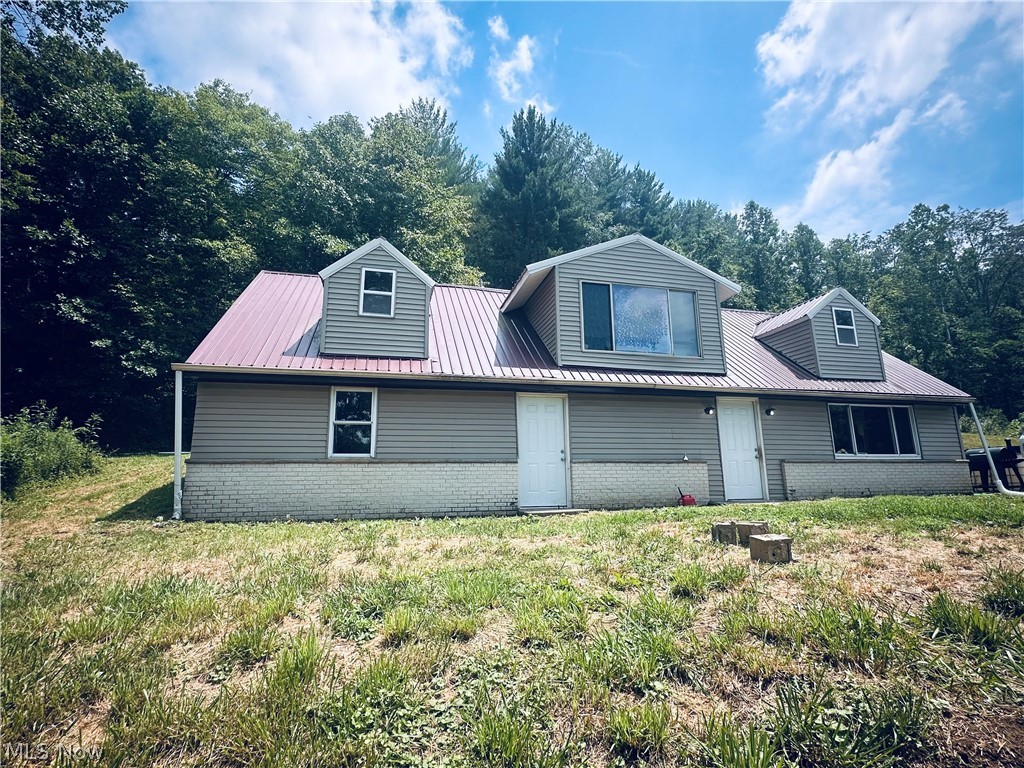 **Privacy, seclusion, and endless outdoor opportunities await on this 14.62-acre wooded property.** Surrounded by mature timber and abundant wildlife, this peaceful setting is ideal for hunting, hiking, ATV riding, or simply enjoying the quiet of country living.
**Privacy, seclusion, and endless outdoor opportunities await on this 14.62-acre wooded property.** Surrounded by mature timber and abundant wildlife, this peaceful setting is ideal for hunting, hiking, ATV riding, or simply enjoying the quiet of country living.

This 3-bedroom, 1-bath Cape Cod, with updates completed in 2011, features an open-concept living, dining, and kitchen area filled with natural light from a large picture window. The kitchen offers a spacious center island and two pantry areas, making it ideal for everyday living and entertaining.

The main floor includes a spacious primary bedroom with dual closets, a full bath featuring a Jacuzzi tub and separate shower, a laundry/utility room, and a mudroom with its own entrance for added convenience. Upstairs, you'll find a cozy family room with a reading nook overlooking the woods, along with two additional generously sized bedrooms.

Additional features include a metal roof (2011), central air (2020), natural gas forced-air heat, a 2,500-gallon gravity-fed spring water holding tank, and septic system.

Whether you're looking for a private residence, hunting property, or recreational getaway, this property offers the space, seclusion, and outdoor lifestyle you've been searching for.

Mineral rights do not convey. Schedule your private showing today!