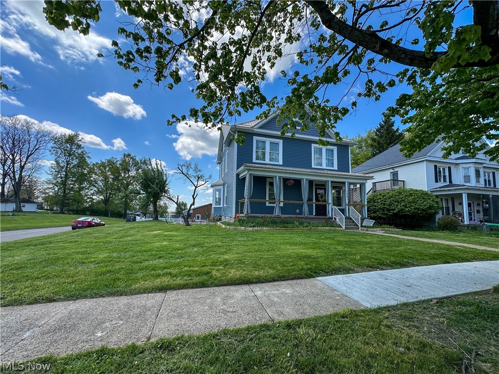 **BACK ON THE MARKET DUE TO NO FAULT OF THE SELLER** Rare opportunity to own a spacious, fully updated home with flexible living—ideal for multi-generational living or a work-from-home setup.

The first floor features a foyer with arched stick-and-ball fretwork and bay window, all new waterproof LVP flooring, a large living area with second bay window, and an eat-in kitchen with pantry, built-in bench seating, brand new dishwasher, and range hood. A mudroom provides access to the rebuilt side deck. The main-level primary suite includes a private bath and walk-in closet, connected to the living room through pocket doors for flexible use as a bedroom, office, or client-facing space.

Upstairs offers three large bedrooms with refinished original hardwood floors and abundant natural light, plus a full bath with double vanity and a spacious laundry room with folding counter.

The finished third floor is an open-concept flex space with closet and half bath, featuring built-in bench seating around the eyebrow window overlooking the yard and church, plus sunset views over the neighboring cemetery. A dedicated mini-split provides independent heating and cooling for this level.

Designed for comfort and efficiency, the home features new energy-efficient windows with transferable warranty, zoned heating and cooling with two furnaces and two central A/C systems, plus the third-floor mini-split. Major updates also include new roof, siding, and complete electrical rewire.

Exterior features include a full-length covered front porch, rebuilt side deck, spacious yard, rear driveway, oversized 1 car attached garage with interior basement access, and additional street parking.

Conveniently located near the grocery store, town square, local school, and Sally Buffalo Park.