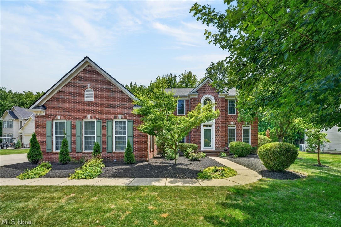 Exceptional Woodmore Estates home on a private cul-de-sac featuring a first-floor owner's suite, finished lower level, 3-car garage, and nearly half-acre lot in one of Avon's most desirable communities. This beautifully maintained 4-bedroom, 3.5-bath home offers the perfect blend of luxury, comfort, and functionality. A welcoming hardwood foyer opens to elegant living spaces, including a formal dining room with 9-foot ceilings and a dramatic two-story family room with a gas fireplace and abundant natural light. The spacious kitchen is designed for everyday living and entertaining, featuring granite countertops, extensive cabinetry, under-cabinet lighting, custom island with seating for four, and a bright morning room. The highly sought-after first-floor bedroom suite includes large walk-in closet, private bath with double vanity, jetted soaking tub, and separate shower. First-floor laundry adds convenience. Upstairs offers three generously sized bedrooms, a full bath, and an open hallway overlooks view of the family room. The professionally remodeled lower level (2022) is an entertainer's dream featuring multiple recreation areas, two bonus rooms ideal for a home office, fitness room or hobbies, granite wet bar, sauna, wine room, and an updated full bath. Outdoor living is equally impressive with a 24x16 deck, pergola-covered seating area, and a 16x12 outbuilding perfect for storage or workshop. The full brick front elevation adds timeless curb appeal. Major updates include new roof (2022), new windows (2022), remodeled lower level (2022), Nature Stone garage floor (2021), interior paint (2026), gutter guards (2023) and under-cabinet lighting (2026). Conveniently located minutes to Avon East Elementary School, Avon Commons, Crocker Park, Cleveland Clinic Hospital, golf courses, parks, restaurants, and quick I-90 access. Rarely does a home offer this combination of space, updates, amenities, and premier Avon location. Move-in ready and designed for today's lifestyle.