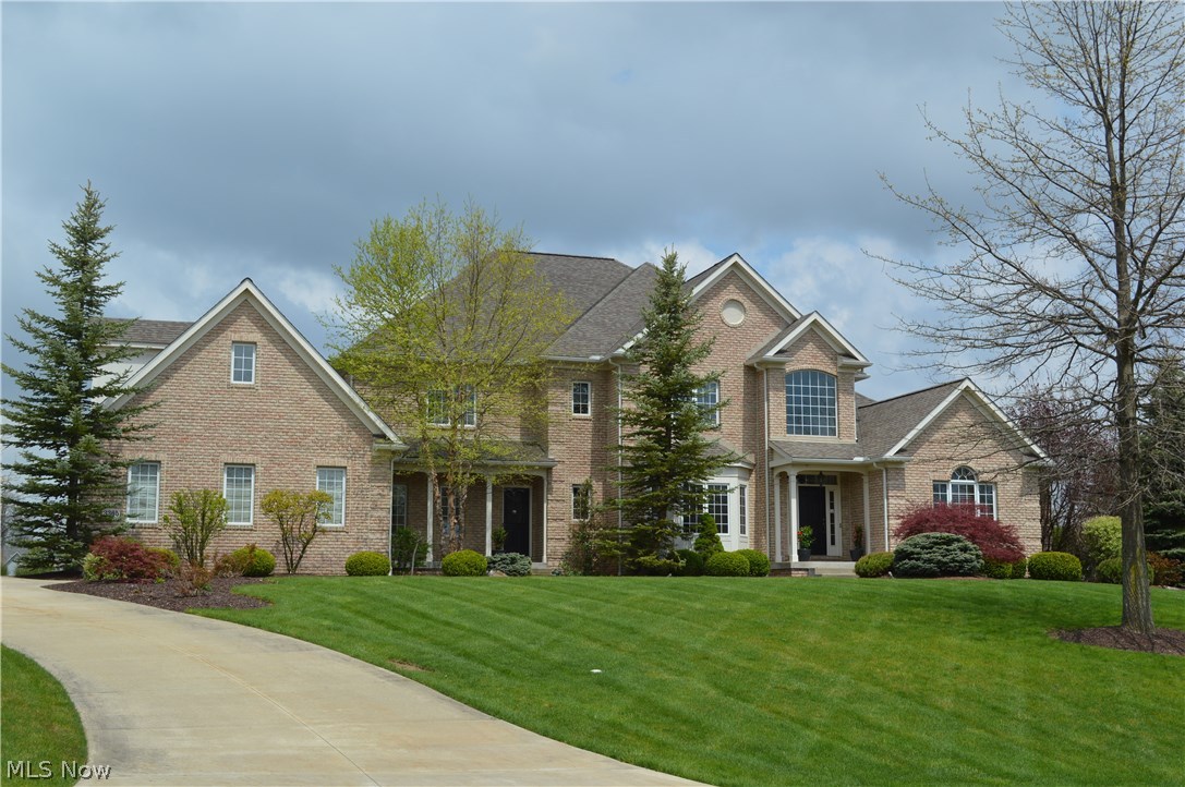 Newly refreshed, exceptionally crafted brick transitional situated on a beautifully landscaped lot overlooking a quiet lake in the heart of Glencairn Forest. Stunning 2 story front foyer opens to a breathtaking vaulted great rm w/stone fireplace & cherry built-ins. The nearby Formal Dining Room features tray ceilings & lies adjacent to the handsome first floor den with fireplace. The gourmet kitchen is equipped with 2 ovens, stainless appliances, glass tile backsplash, tumbled tile floor & a quaint dinette area w/entrance to screened in porch. An attached gathering rm offers a cozy fireplace & lake views! The 1st floor master suite offers an incredible MBA w/ slate floors, multi-head shower & walk-in closet. 3 sizable bedrooms, 3 full baths, & a large bonus room complete 2nd floor. The finished LL includes a full bar, theater, exercise rm & half bath. Additional features: front & rear staircases, 1st floor laundry, service entry & 4 car attached garage. Total sq ft is 7136, footage fro
