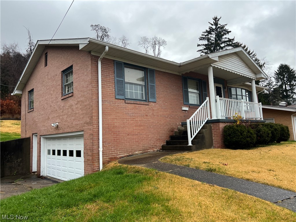 Welcome to 419 Elm Street, Martins Ferry. 1965 Brick Ranch home. Three bedrooms two bathrooms and a two-car attached garage. Per the seller there may be hardwood floors under the carpet. Living Room is 16 x 16 and the master bedroom measures 13 x 13. Entertain in your lower level rec room with a fireplace.