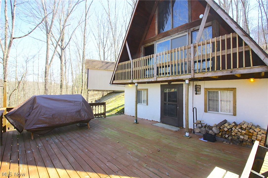 CLENDENING LAKE CABIN!! One of Eastern Ohio's best fishing lakes, Clendening is a Muskingum Watershed Conservancy District lake and the largest undeveloped lake in Ohio with over 1,700 surface acres and 37 miles of shoreline. Clendening offers a true back-to-nature experience, far from the crowds, yet close to home. It's a great place for boating, fishing, paddle sports, hiking and much more. 10 HP max. Only minutes to Clendening Marina and also less than 10 minutes to Tappan and Piedmont lakes. Adjacent to thousands of acres of public hunting. With an industrial look the Living room & kitchen are on the lower level with access to the large deck. Main floor is currently used as a large open bedroom. The Unique loft area can be used as a second bedroom. Large storage building. Cabin is on private land and not subject to MWCD lease fees. Road is maintained by Nottingham Township.