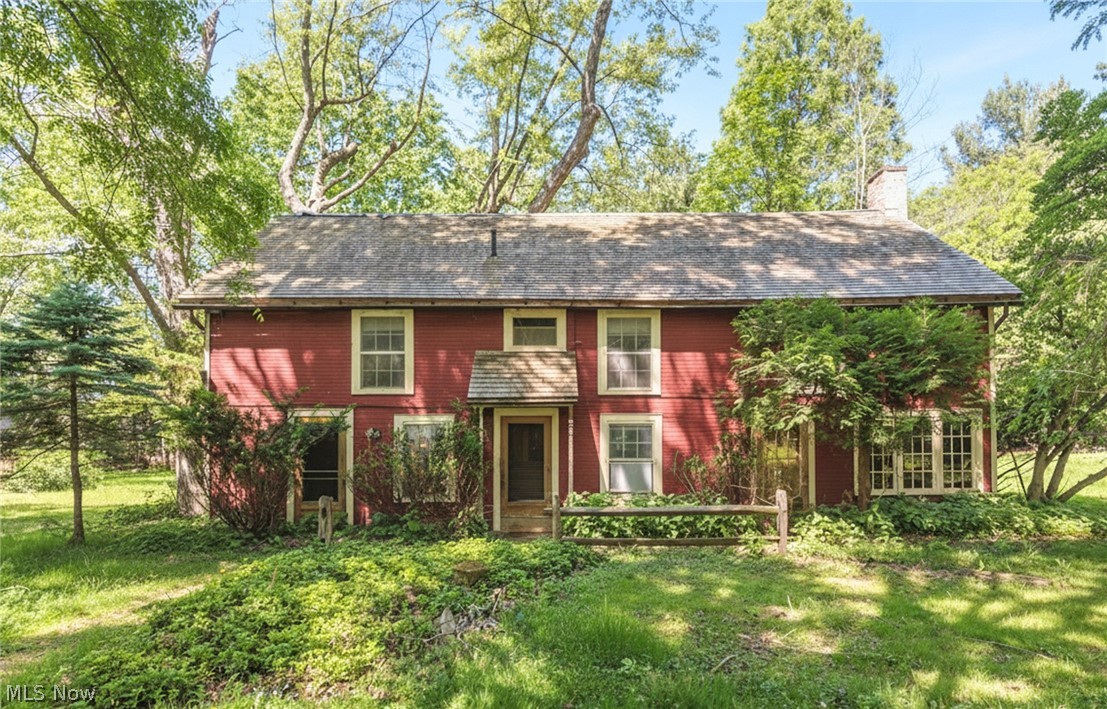 Set on a 1.34-acre wooded lot, this Historic Western Reserve Farm offers a rare opportunity to own a charming Colonial home complete with a barn and additional outbuilding. The residence features warm, rustic Walnut floors and a spacious first-floor Family Room. Dining Room is highlighted by a striking stone fireplace. Two generously sized Bedrooms, each with its own adjacent Bath for comfort and privacy, are on the second level. A delightful Screened Porch and Stone Patio provide perfect outdoor spaces to enjoy the changing seasons in this picturesque, park-like setting. Barn could be reconfigured as space for a car collector, craftsman workshop, or artist's studio. Ideally located close to Euclid Creek Metropark, Lake Erie access, area shopping and dining. This unique property has all the potential to become an inviting and timeless Country Estate!