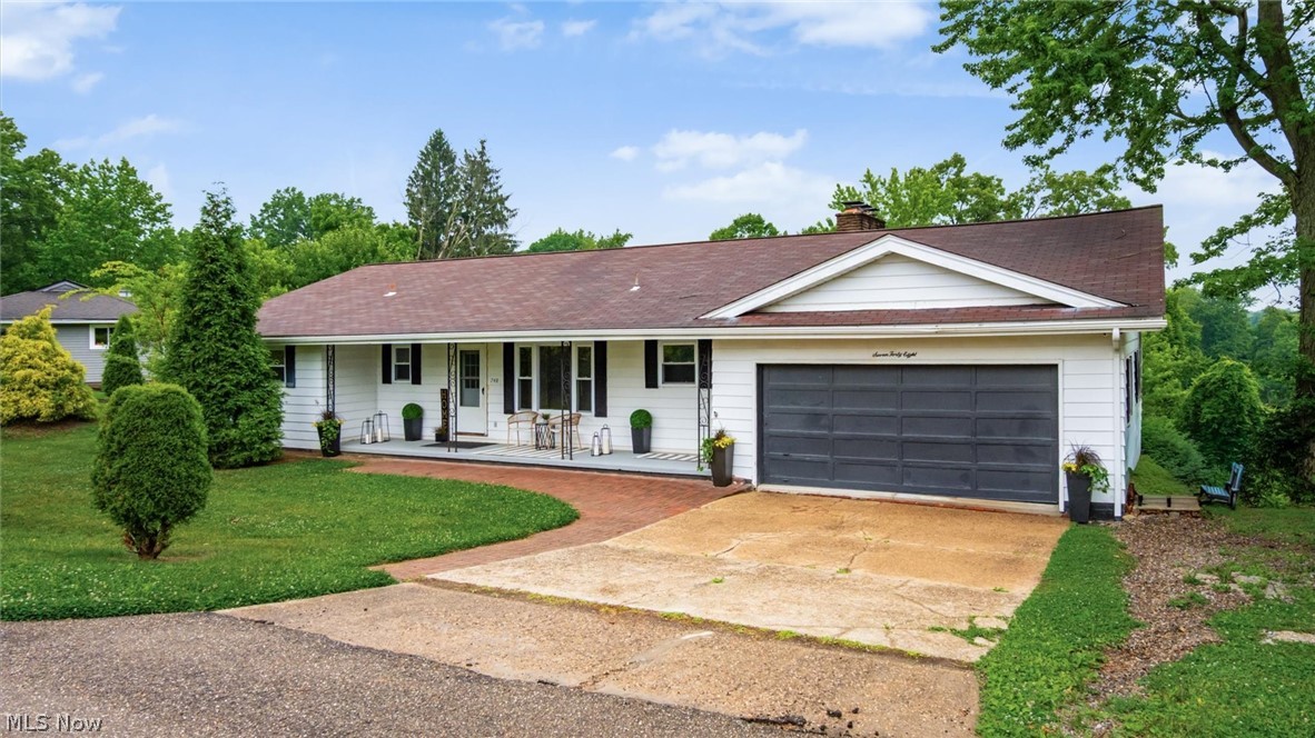 **Open House 06/25, 5:30-7:00pm & 06/27, 11:30am-1:00pm** Located in an established Coshocton neighborhood, this refreshed mid-century ranch offers over 1,600 square feet of main-level living space, 3 bedrooms, 1.5 baths, a 2-car attached garage, and a generous 0.54-acre lot. Full of character and warmth, the home features a spacious living room centered around a stylish fireplace, creating an inviting space to gather and relax. Just beyond, the sunroom is filled with natural light and is sure to become a favorite spot for morning coffee, quiet afternoons, or winding down at the end of the day. The main level offers a functional layout with comfortable living spaces, a dining area, and plenty of room to make it your own. Downstairs, the walk-out lower level provides added flexibility with a finished 4th bedroom, office, or bonus room, along with a large unfinished area ideal for storage, a workshop, or future expansion. Offering the convenience of one-floor living with additional space below, this home combines timeless mid-century appeal, everyday functionality, and endless potential. Conveniently located less than 3 miles from schools, the hospital, restaurants, shopping, and other everyday amenities, it offers the perfect balance of neighborhood living and accessibility.