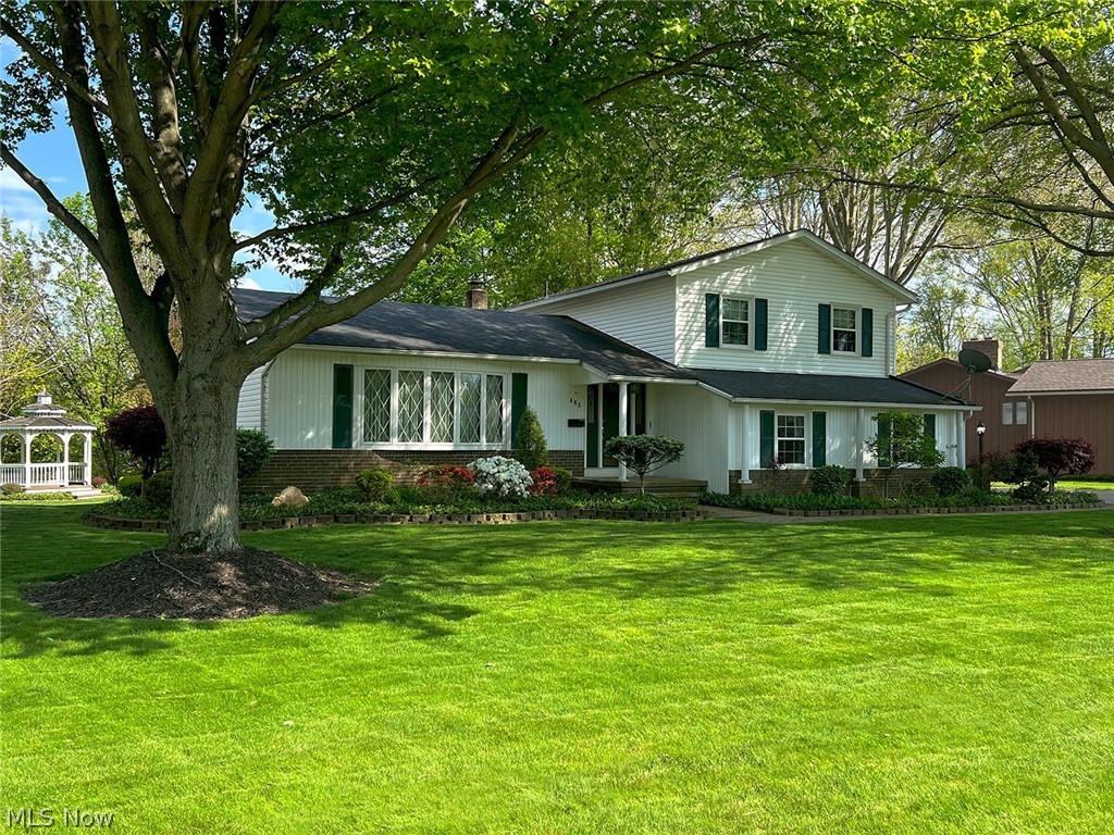 Tucked away on a beautiful park-like lot, this inviting Amherst home is all about location, location, location. Nature lovers will fall in love with the private backyard oasis featuring mature trees, a peaceful creek boundary, and two tastefully built storage sheds that blend perfectly into the landscape. Whether enjoying morning coffee, watching wildlife, or hosting gatherings, this property offers a rare sense of serenity and space. Inside, the home offers warm and comfortable living with an eat-in kitchen featuring ample cabinetry and counter space. The formal dining room is ideal for holiday dinners and special occasions, while the large living room and cozy family room with fireplace provide plenty of room to relax and unwind. The oversized screened-in porch truly brings the outdoors in — a perfect setting for entertaining friends, family gatherings, or simply enjoying the sights and sounds of nature. The finished basement adds even more versatility with an additional family/recreation room, laundry area, and extra workshop or flex space to fit your needs. Upstairs you’ll find three comfortable bedrooms and a full bath, while the home also includes an additional half bath for convenience. The side-entry garage has been thoughtfully designed with built-in cabinetry and a bench area to keep everything organized and functional.This is the kind of property that feels like home the moment you arrive — peaceful, welcoming, and surrounded by nature.