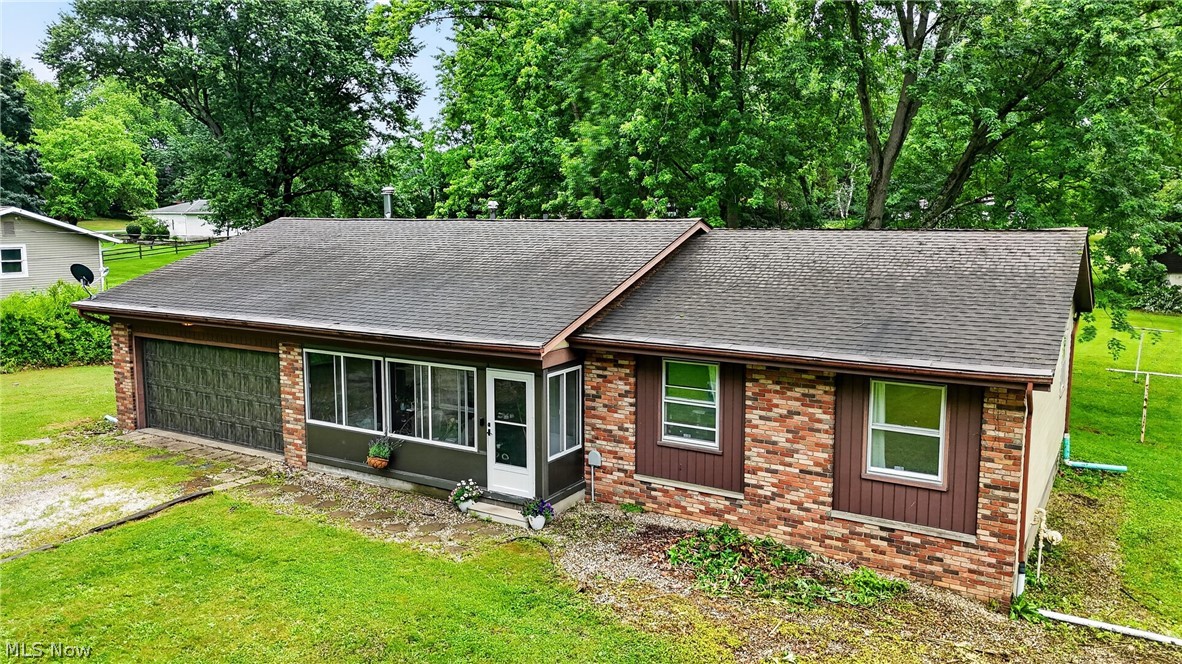 Welcome home to this beautifully updated ranch situated on nearly an acre in Uniontown! This move-in-ready home offers the perfect blend of comfort, space, and functionality. The inviting interior features newer flooring, updated paint, an updated electrical panel, newer appliances, newer furnace and a newer water softener system.

The spacious floor plan includes a large living room plus an additional flex space that could serve as a formal dining room, family room, home office, or playroom. Cozy up by the wood-burner and enjoy the warmth and character it brings to the home.

The kitchen offers ample cabinet and counter space, while the generously sized bedrooms feature great closet storage. Enjoy relaxing mornings on the enclosed front porch or entertain family and friends on the rear patio overlooking the spacious backyard.

Outside you’ll find a 2-car attached garage, a barn/outbuilding for additional storage, hobbies, or workshop space, and plenty of room to enjoy the outdoors. Conveniently located yet offering a peaceful country feel, this property is one you won’t want to miss!