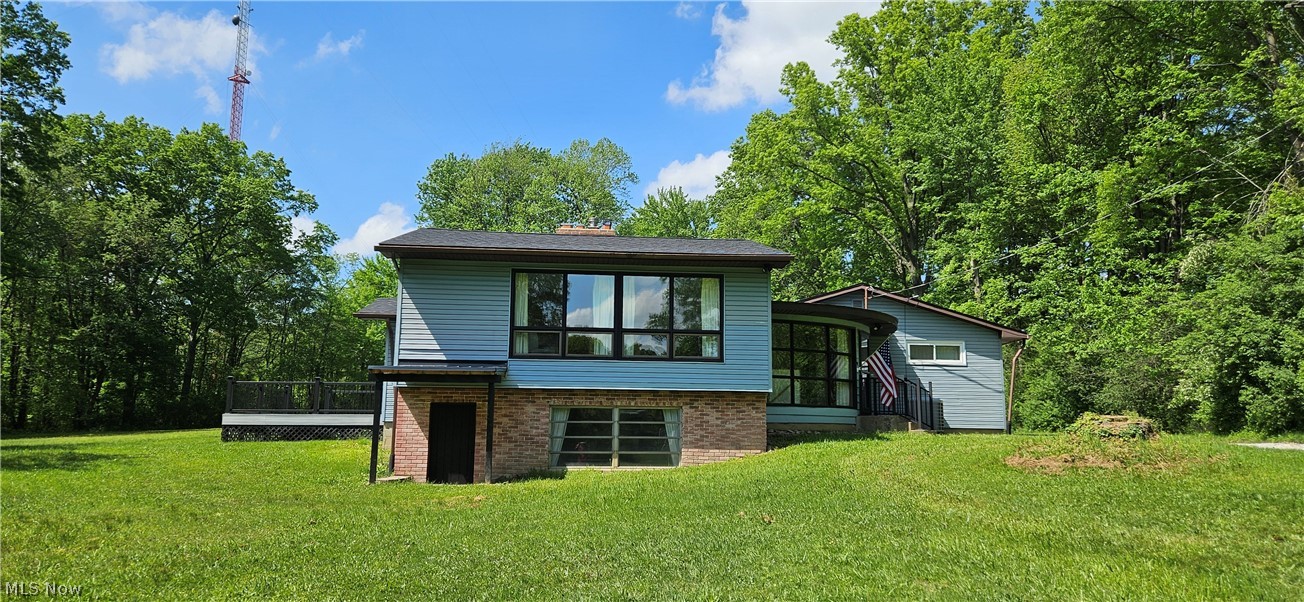 Tucked away on 3 private acres and hidden from the street by mature trees, this newly remodeled 3-bedroom home offers the perfect blend of comfort, craftsmanship, and seclusion. A private driveway leads you to a property that feels like its own world—quiet, peaceful, and bordered by a small creek that adds to the charm.

Inside, the home features a foyer with a spiral staircase that leads to a finished 1,247 sq ft lower-level great room complete with paneling and a wood-burning fireplace, ideal for gatherings or cozy evenings. An additional 1,249 sq ft unfinished basement provides endless potential for storage, hobbies, furnace, water heater, washer and dryer. If you go up a couple of stairs from the foyer, you enter a large, finished living room that looks out over the front lawn.

Recent upgrades include:

New composite 16' x 16' deck off the finished sunroom with a new sliding door

New asphalt roof on the home (2022)

New asphalt roof on the 660 sq ft 2-car garage and the 48' x 72' shop (2025)

New flooring in the kitchen, foyer, hallway, and bathrooms

New vinyl double-paned windows in bedrooms and bathrooms.

The massive 48' x 72' shop is a handyman’s dream—complete with a built-in compressor and the option to heat with a wood-burning stove. The property also includes an attached carport for added convenience.

With central cooling, propane heat, and security cameras inside and out, this home offers modern comfort while maintaining a secluded, country feel. Just minutes from town, it’s a rare combination of privacy and accessibility—truly a unique property ready for its next chapter.