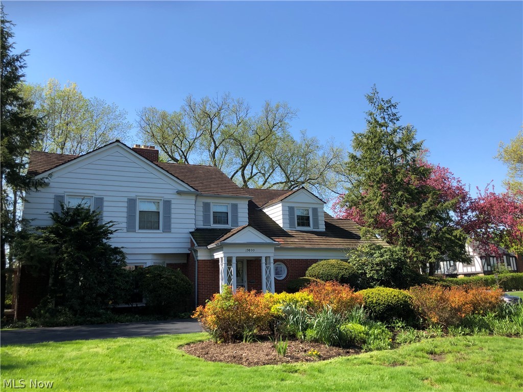 Mid-century club section colonial on more than a half an acre! Updated eat-in kitchen with granite countertops and stainless steel appliances. Fantastic open floor plan. First floor library/family room and large sunroom off kitchen. Half bath and full shower on first floor. Four bedrooms, two full baths on second floor. Outstanding master suite with private full bath. Lower level recreation room with fireplace, half bath, shower, wet bar and tons of storage. Large, secluded private yard with deck and hot tub. Attached garage and central air! Lots of updates, including new windows! (Note: 1st floor library and full bath can be a private first floor suite if needed.) Shaker Heights Compliance!