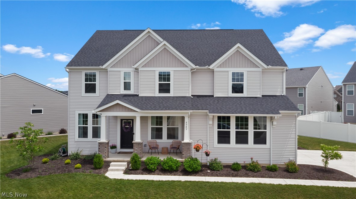 Welcome home to this stunning front-porch colonial, where timeless design meets modern comfort. The highly sought-after Buchanan floor plan offers an open and airy layout enhanced by wide-plank LVT flooring throughout the main level.
At the heart of the home is an exceptional chef’s kitchen featuring an impressive 7-foot island, upgraded KitchenAid stainless steel appliances, abundant counter space, and a breakfast bar with seating for four. The spacious dining area flows seamlessly into the expanded great room, highlighted by soaring vaulted ceilings and a classic fireplace—perfect for everyday living & entertaining.
The first floor also offers a private home office, convenient mudroom, and powder room, along with a formal dining room ideal for hosting holiday gatherings and special occasions. A charming rear staircase leads to the second floor, where you'll find three generously sized secondary bedrooms, each with its own walk-in closet. The luxurious primary suite serves as a true retreat, featuring a spacious walk-in closet and a spa-inspired bath with dual vanities, soaking tub, separate shower, and private water closet. An additional full bath offers a dual-sink vanity, solid-surface countertops, and a tub/shower combination.
 The finished lower level provides exceptional additional living space, including a large theater room, fitness area, half bath, recreation space, and ample storage—perfect for movie nights, game days, and entertaining family & friends. Step outside to enjoy the beautifully private backyard, complete with stamped concrete patio and plenty of room for children and pets to play. Nestled in a peaceful neighborhood known for its friendly atmosphere and sense of community! This special home offers the perfect combination of comfort, style, and room to grow.