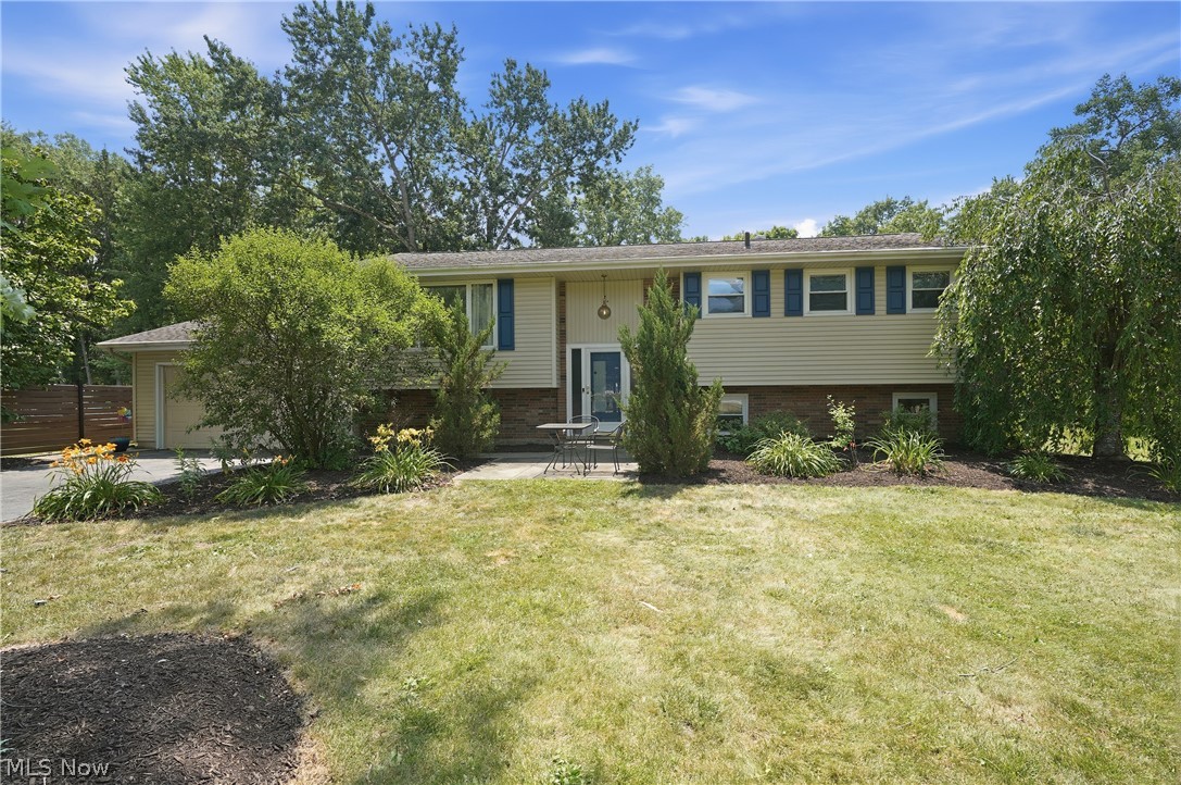 WHEW – finally, your dream home has hit the market!  This beautifully updated 4 bedroom, 2 full bath home boasting over 2,000 sq ft is nestled on nearly ¾ acre – in other words, it is exactly what you have been waiting for.  Welcome to 8984 Cherokee Run. This beauty offers an ideal blend of classic design & modern amenities. Step inside to a bright, open-concept main level where natural light fills the spacious living room, dining area, & beautifully updated kitchen featuring butcher block countertops, updated flooring, modern lighting, & contemporary finishes. Sliding doors lead to a large deck overlooking a private backyard complete with a picturesque creek—perfect for entertaining, relaxing, or enjoying nature. The upper level features 3 spacious bedrooms and remodeled full bath. The finished lower level offers a large family rm, 4th bedroom, and 2nd full bath, providing flexible space for guests, a home office, or multi-generational living. The backyard is truly an oasis, featuring a gazebo, hot tub, fire pit, privacy fence, invisible pet fence, mature trees, creating the perfect setting for outdoor enjoyment year-round. Extensive updates provide peace of mind, including newer HWT, appliances, fixtures, lighting, and tree removal ‘25; garage door springs ‘26; professional air duct cleaning ‘23; gazebo, hot tub, privacy fence, and butcher block countertops ‘22; sump pump w/ battery backup, backflow valve, flooring, railings, ceiling fans, &  invisible fence ‘21; concrete leveling '22; professionally painted upper level & deck safety improvements ‘20; A/C ‘18; roof & furnace ‘16.This meticulously maintained home combines modern updates, versatile living space, and an incredible outdoor setting in one exceptional package. Schedule your private showing today! Seller offering a 1 yr home warranty.  A more extensive list of updates is also offered in the supplements.  This is definitely one you don't want to miss out on!