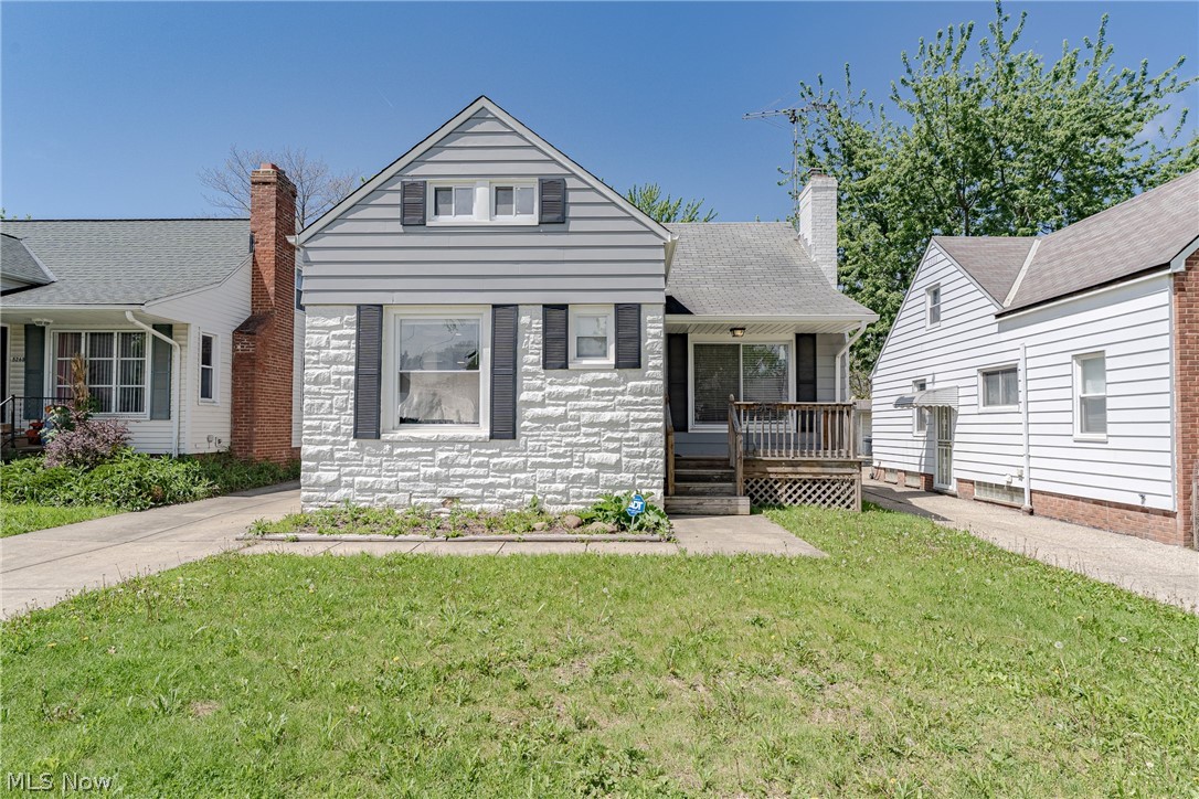 Welcome to 5264 E 117th St in Garfield Heights, a beautifully refreshed Cape Cod offering a bright, modern feel and flexible living spaces throughout. The main level features an open floor plan that seamlessly connects the living room, kitchen, and dining areas. The living room is filled with natural light and showcases a white stone fireplace, recessed lighting, and laminate-style flooring. The kitchen is designed for both style and function. It includes white shaker cabinetry, granite countertops, a tile backsplash, and stainless steel appliances. A large window brightens the dining area, while a sliding barn door adds character and provides access to the side entrance and lower level. Two bedrooms are located on the first floor. Both feature newer flooring and ceiling fans. An updated full bathroom with a tile shower surround completes the main level. Upstairs, the second floor offers a third bedroom and a finished bonus space. This flexible area works well as a home office, den, or reading nook. The finished basement expands the living space with a spacious recreation room currently set up as a bedroom. It includes glass block windows and LVP-style flooring, adding comfort and versatility. This home combines thoughtful updates, an open layout, and flexible spaces in a convenient Garfield Heights location.