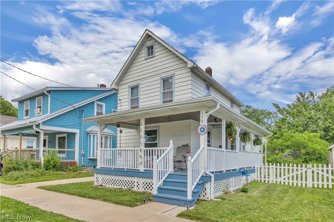 Boasting captivating Lake Erie views, a grand wrap-around front porch, and rare direct beach access, this standout Fairport Harbor lake view home offers the ultimate coastal lifestyle. Perfectly positioned on one of the community's few single-family streets with a direct path to the sand, this move-in-ready, two bedroom house serves as a remarkable year-round residence or a turnkey summer getaway. The updated interior features beautiful, seamless hardwood flooring stretching through the primary living areas, open dining space, and both bedrooms. A fully equipped kitchen is designed for effortless meal prep, complete with modern stainless steel appliances, extensive cabinet storage, and durable luxury vinyl tile (LVT) flooring. Move outside to your private backyard oasis, featuring a fully fenced yard, an entertaining deck, and lush perennial landscaping with mature magnolia and hibiscus trees. Designed with longevity in mind, the impressive front porch features heavy-duty structural framing, offering incredible future potential for a seasonal enclosure or vertical expansion. Bringing sensational value and peace of mind, this beach house features a suite of major capital improvements and thoughtful updates. These critical investments include a brand-new porch roof, comprehensive modern electrical upgrades, a fresh coat of interior paint in key areas (including the bedrooms, bathroom, and kitchen), and a lifetime-guaranteed sump pump installation. Immerse yourself in a vibrant lakefront community famous for world class Lake Erie fishing, boating, and shoreline recreation. Located near Grand River boat launches and local marinas, Fairport Harbor is an angler’s paradise renowned for walleye and perch. Anchored by two iconic lighthouses, this golf-cart-friendly town offers a spectacular public beach, local festivals, and a welcoming business district just 30 miles from Cleveland. Invest in prime Ohio coastal real estate and live the ultimate boater's lifestyle!